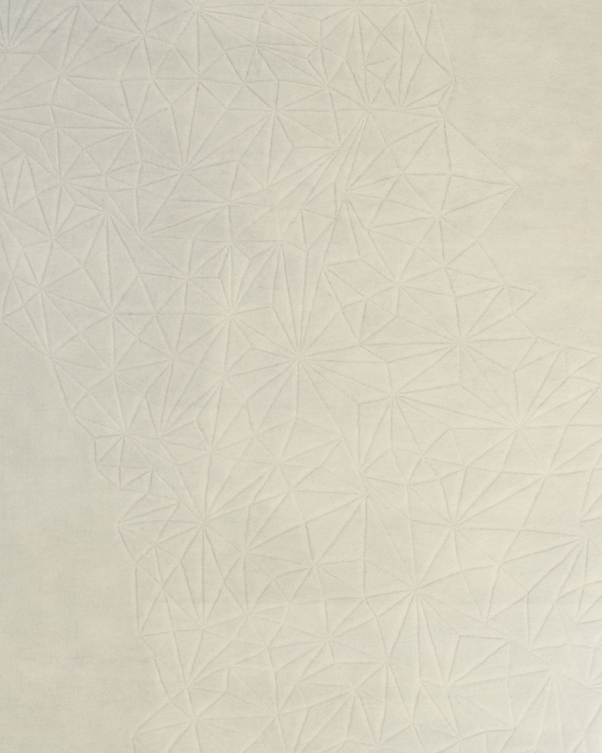 Featuring the Handmade Multi Color Carpet For Home Decor HTW-68 by RAMSHA HOME, this design showcases a light gray surface adorned with an embossed geometric pattern of interconnected triangles, echoing the look of a geometric-patterned rug. The subtle, textured motif gently fades towards the edges for a sophisticated and understated finish.
