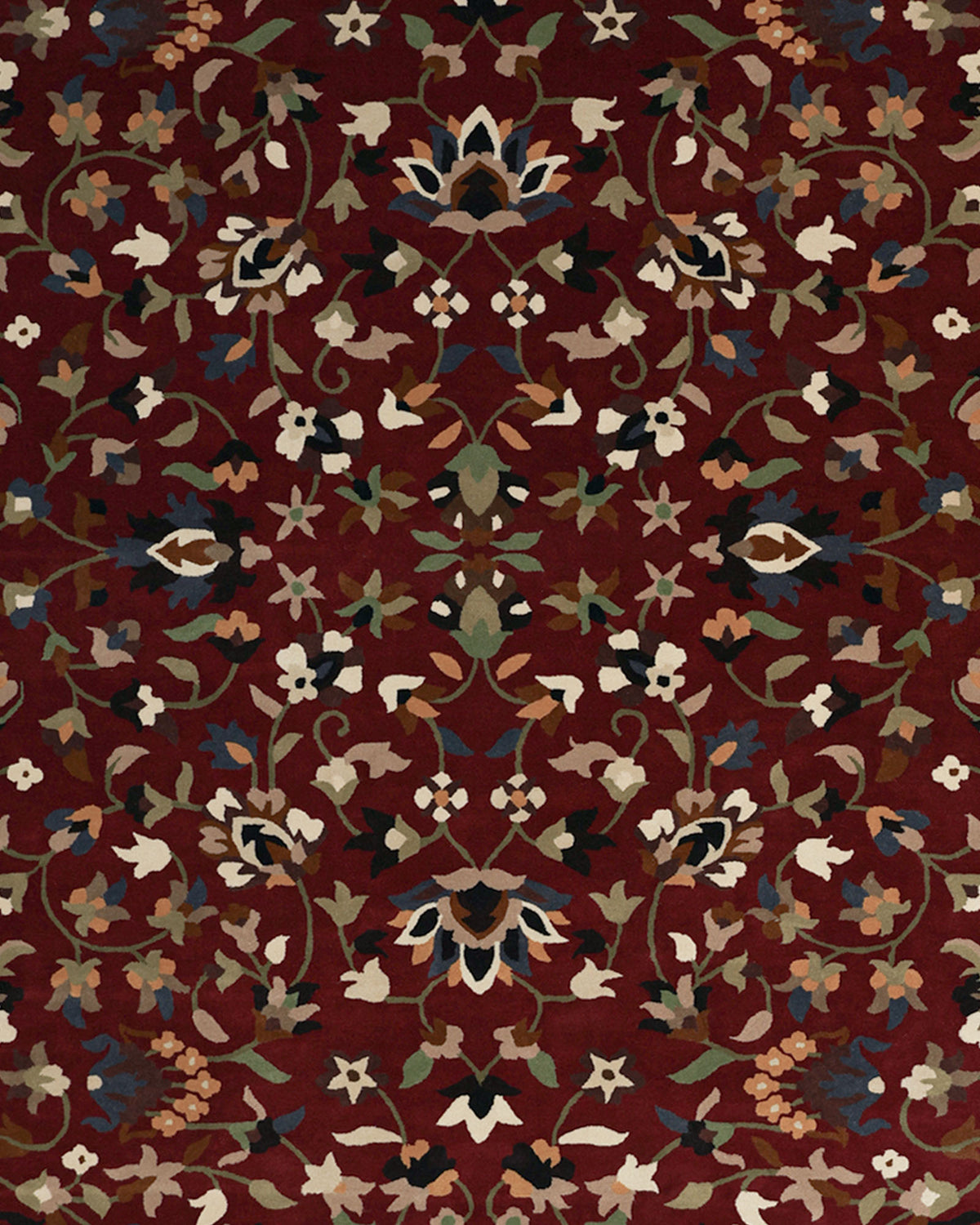 The Wool & Cotton Handmade Area Rug HTW-08 by RAMSHA HOME showcases an intricate, symmetrical floral and vine motif in blue, beige, green, and cream tones on a rich maroon background. This traditional Persian-inspired rug features a design that is masterfully mirrored across both axes for a balanced, ornate look.