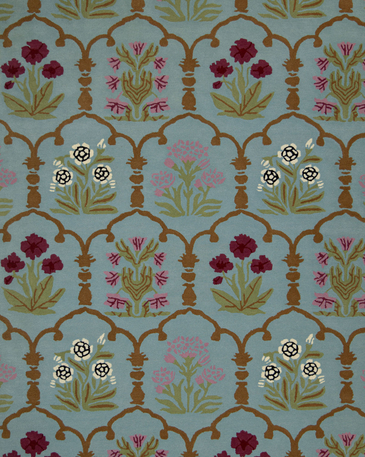Featuring an ornate and symmetrical repeating floral pattern with red, white, and pink flowers accented by green leaves and framed by golden arches on a light blue background, the RAMSHA HOME Handmade Blue Floral Wool Carpet HTW-25 is a stunning area rug that beautifully complements both classic and contemporary interiors.