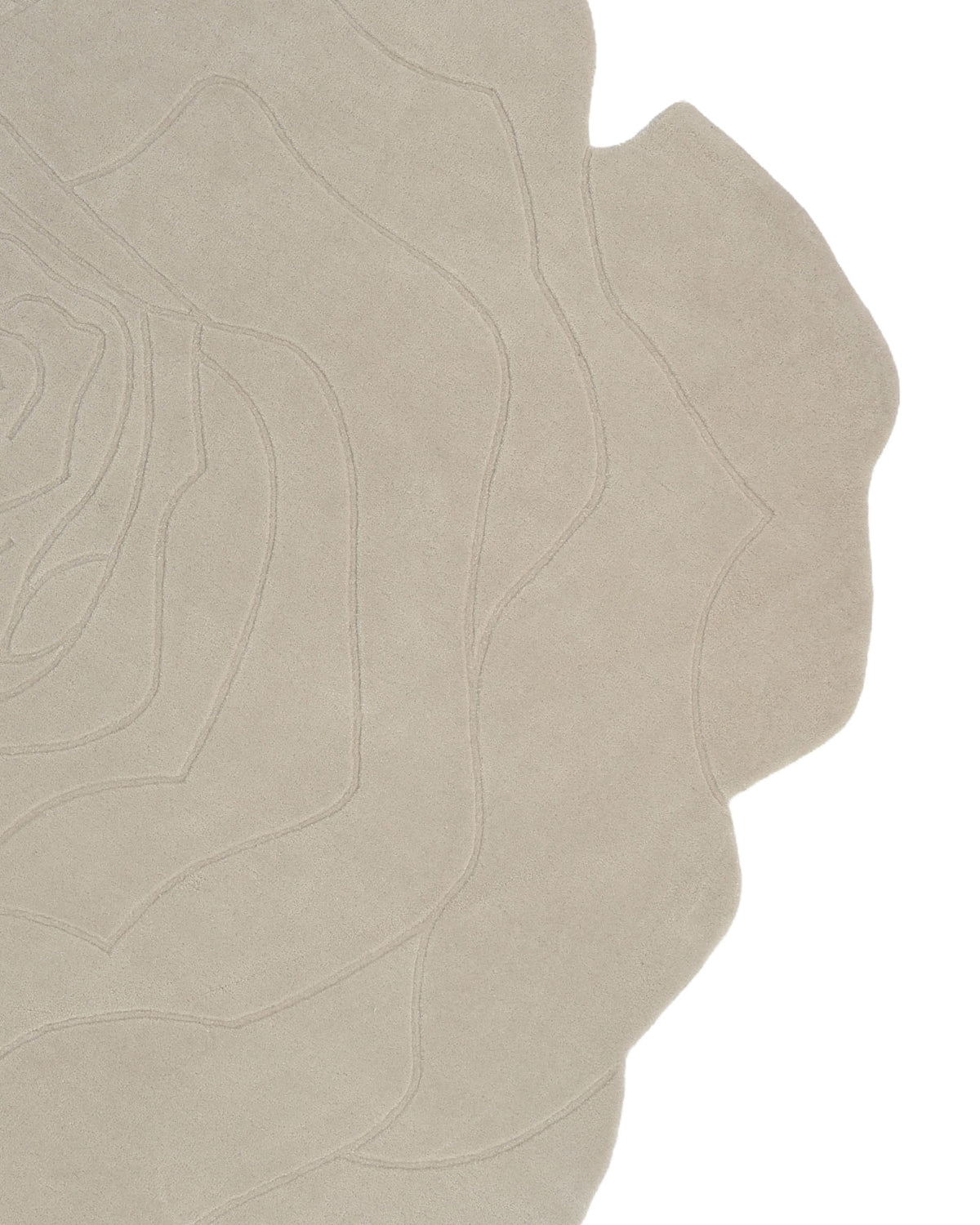 Introducing the RAMSHA HOME Handmade Rose Shape Rug HTW 106—a beige, hand-tufted area rug crafted in the shape of a rose. Featuring subtle, raised outlines that trace abstract petal forms and an irregular edge that follows the natural contours of flower petals, this minimalistic design adds a gentle floral touch to any space.