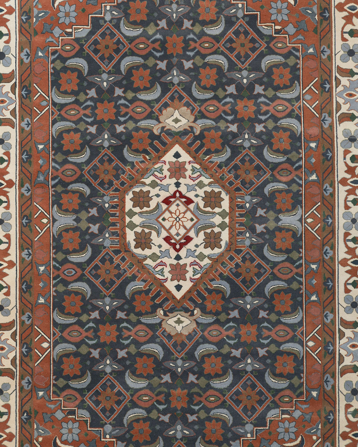 The RAMSHA HOME Hand Knotted Traditional Persian-Inspired Floral Medallion Rug (240x375 cm, HKW-07) features a rectangular design with a central diamond medallion, adorned with floral and geometric patterns in rich red, blue, and cream tones. Intricately bordered by elegant floral motifs, this rug exemplifies timeless craftsmanship and traditional elegance.