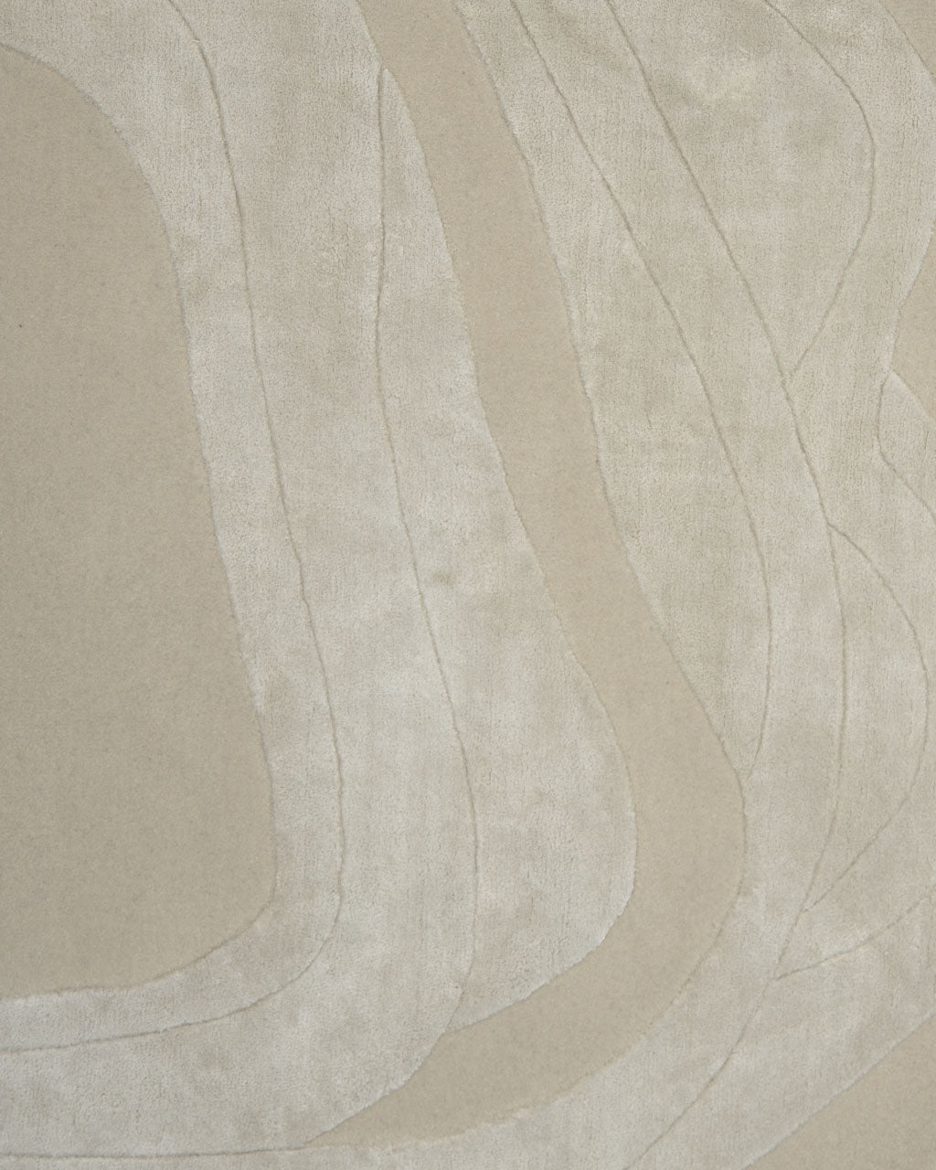 The RAMSHA HOME Handmade irregular 200x300 cm Rug HTWV-191 features a plush, velvety texture in beige and light cream tones, with curved, raised lines creating soft, wavy abstract patterns across its surface.
