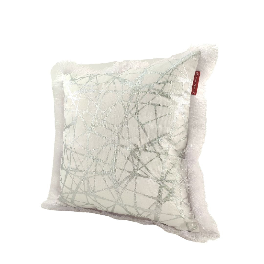 Enhance your space with the RAMSHA HOME CS-123 White & Silver Cushion—square with a shiny silver geometric pattern on white, white fringe border, and a small red brand tag for a stylish accent.