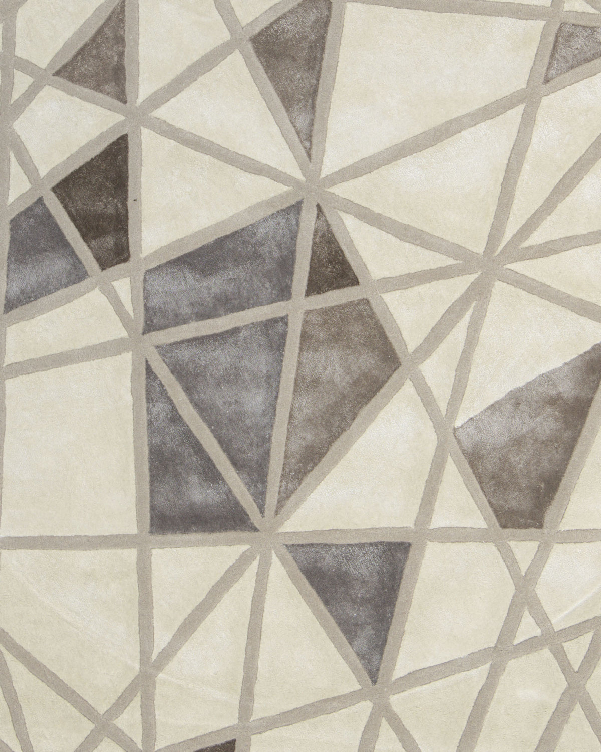 The Geometric Round Handmade Rug 200 cm – HTWV 206 by RAMSHA HOME features an abstract mosaic of overlapping gray, beige, and off-white triangles outlined with fine lines, creating a striking neutral pattern that effortlessly enhances any modern interior.