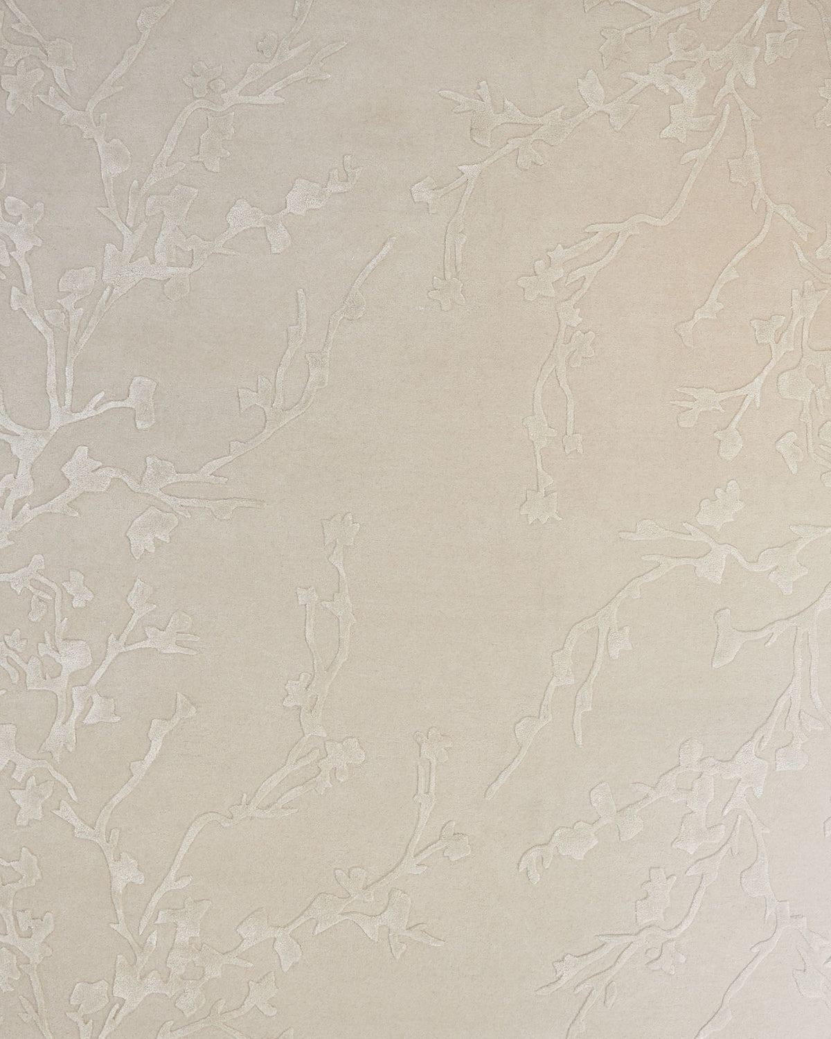 Handmade beige Color Decor Rug- HTWV 115 by RAMSHA HOME features a subtle raised pattern of delicate branches and small flowers, creating an elegant and understated botanical design reminiscent of a beige floral rug.