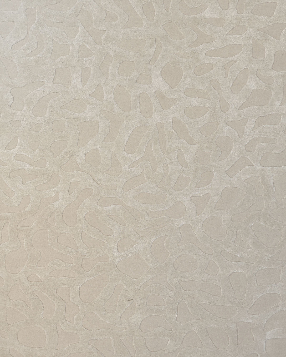 The Rectangle Modern Handmade Rug 200x300 CM HTWV-197 by RAMSHA HOME features a beige surface adorned with an abstract, raised pattern of irregular, organic shapes, creating a subtle textured effect reminiscent of the artistic motifs found in hand-woven rugs.