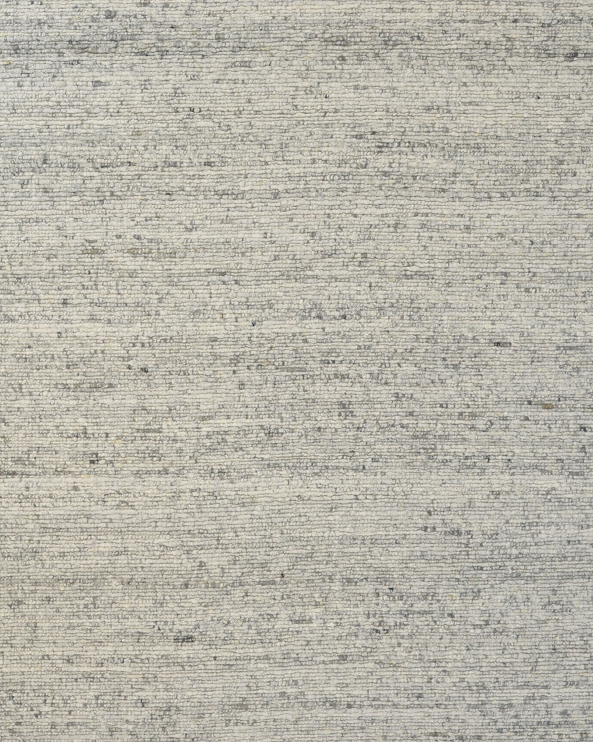 A close-up view of the Soft Terra Flatweave Wool Rug (SRN-043) by RAMSHA HOME highlights its textured gray fabric, featuring a subtle horizontal weave pattern and gentle color variations that reflect traditional craftsmanship.