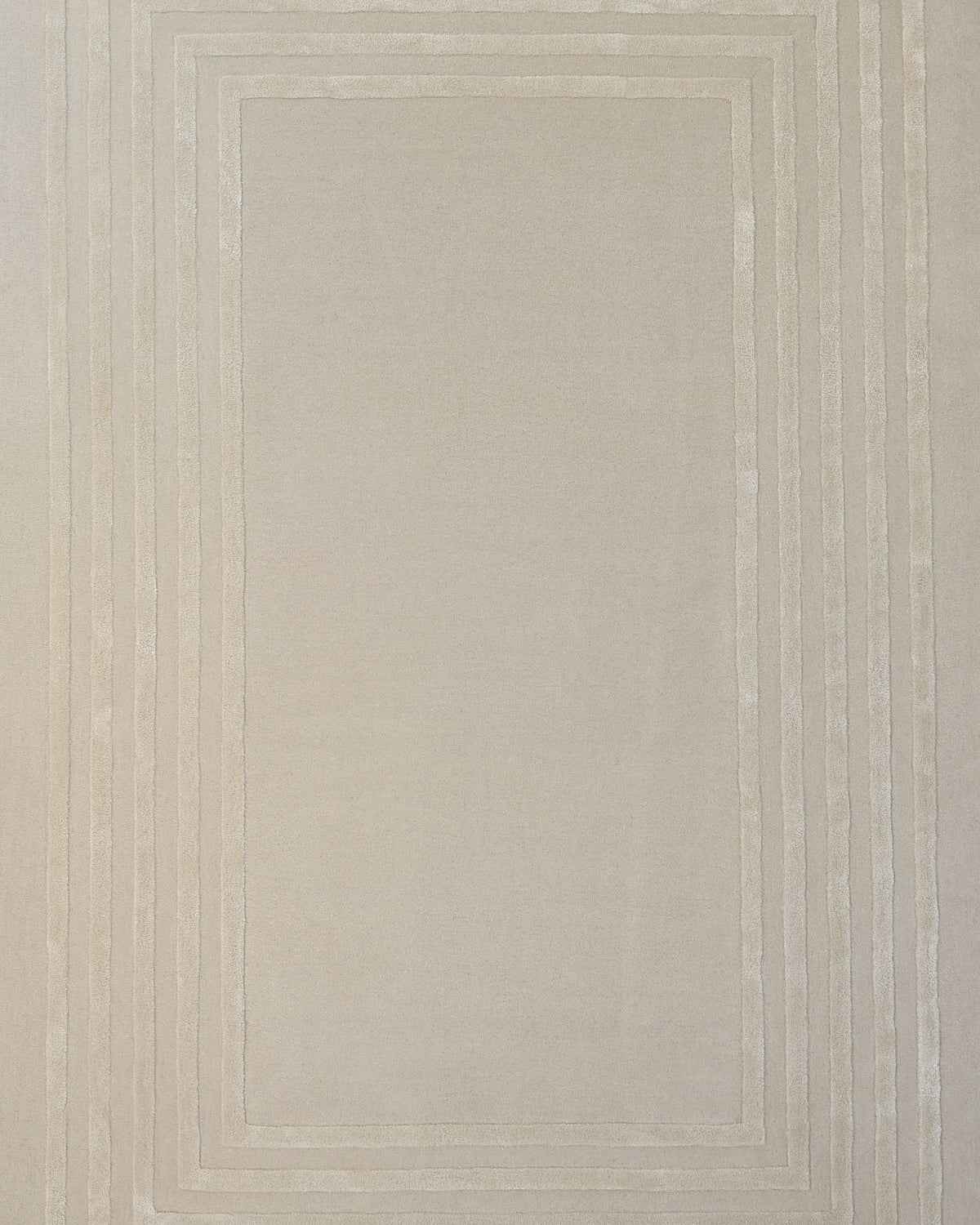 Introducing the RAMSHA HOME Hand-Tufted Carpet For Home And Office HTWV-70: a beige rectangular rug featuring a minimalist design with three thin, raised borders running parallel to each edge. Crafted from wool, this elegant and timeless floor covering is perfect for contemporary spaces.