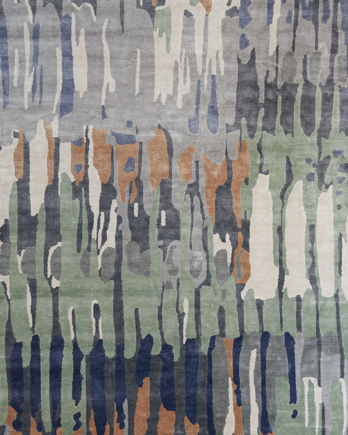 The RAMSHA HOME Decorative Area Carpet Tencil & Cotton Multi Color HKV-09 features an abstract design with vertical, uneven brushstroke patterns in shades of green, blue, gray, white, and tan. This hand-knotted rug showcases a modern and artistic look with its organic blend of colors.