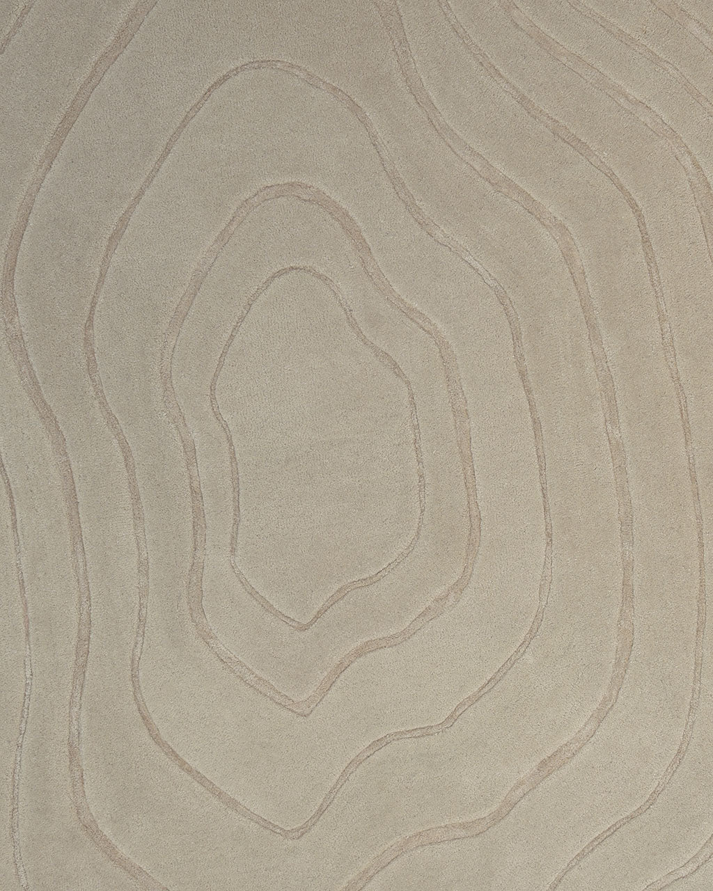 The Hand Tufted Beige Color Decor Rug HTWV-108 by RAMSHA HOME showcases a tan surface etched with concentric, irregular lines reminiscent of a topographic map. Subtle shading and textural variations in the design evoke the artisan quality of a hand-tufted wool Tencel rug, while its neutral palette introduces modern texture and depth to any space.