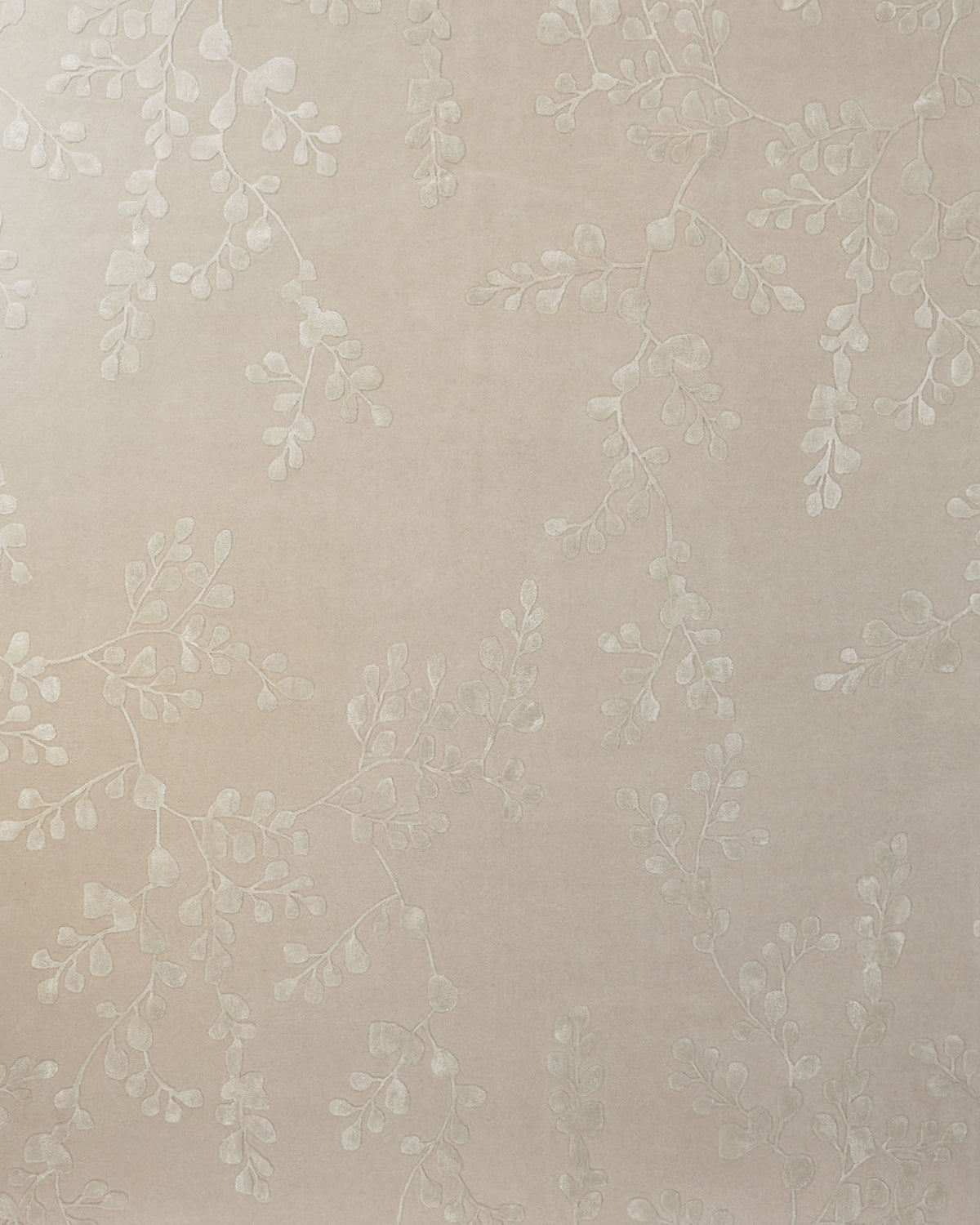 Beige wallpaper with a subtle, raised pattern of delicate, leafy branches spread evenly across the surface, creating a harmonious backdrop that would beautifully complement the RAMSHA HOME Artisan Handmade Decorative Area Rug – HTWV-116.