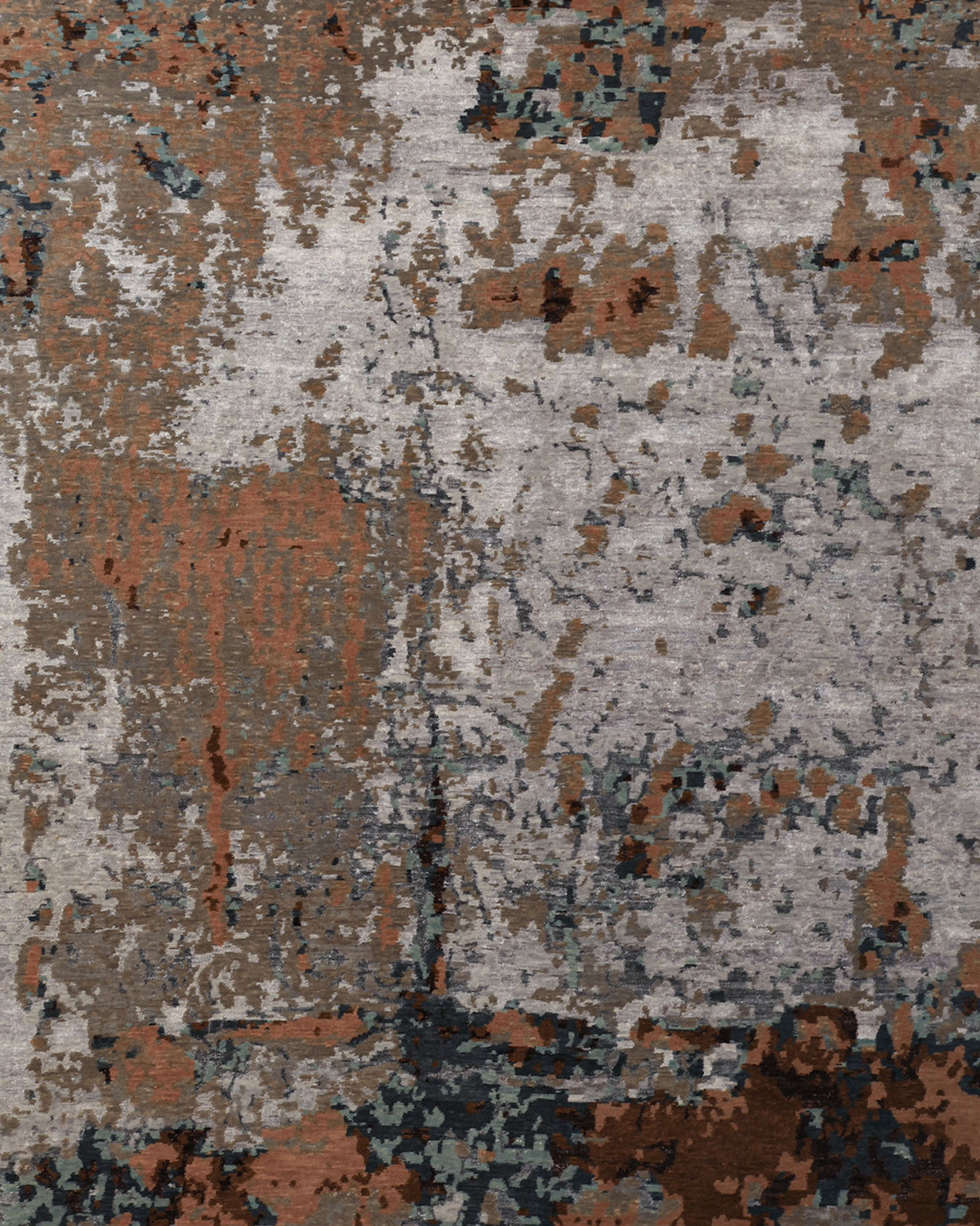 Crafted by RAMSHA HOME, the Bamboo Silk & Cotton Hand Knotted Carpet HKWB-012 features an abstract pattern with mottled patches in brown, gray, black, and bluish tones. Its hand-knotted design mimics weathered or textured surfaces with irregular shapes and rough, uneven edges throughout.
