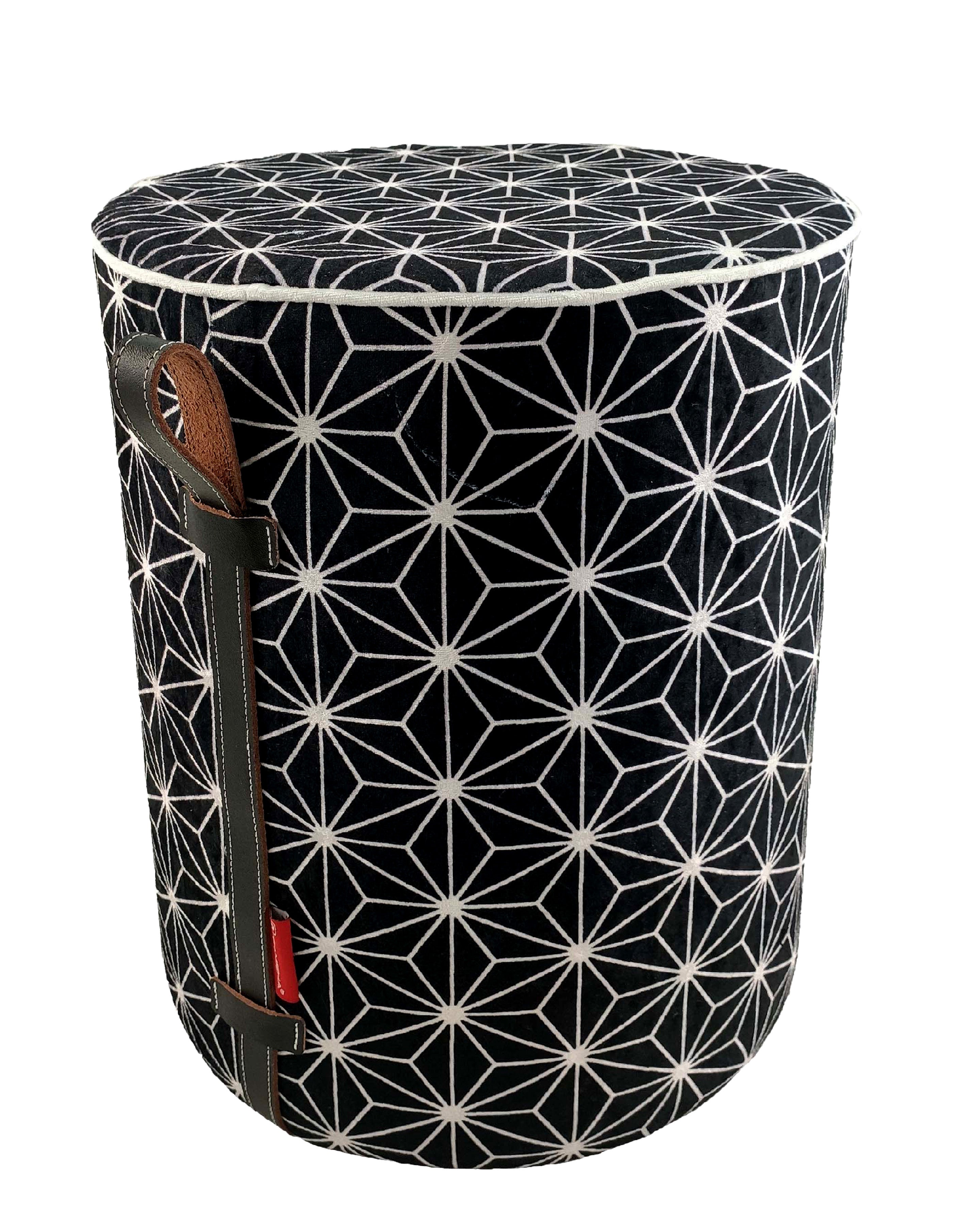 The RAMSHA HOME Printed Pedestal Pouf With Leather Handle PF-027 features a black and white geometric star pattern and a leather handle with red accent—an eye-catching modern decor piece.