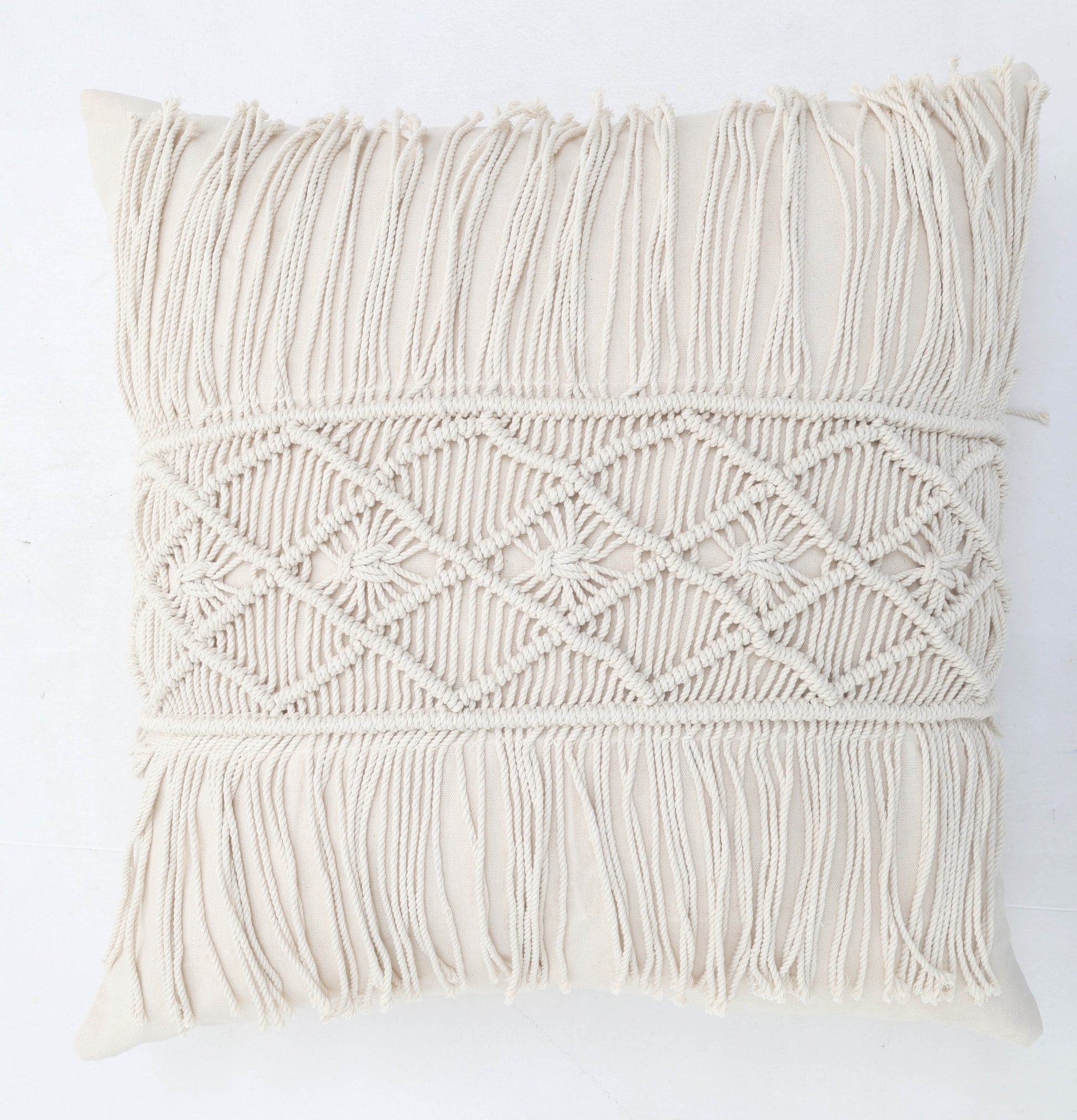 The Ramsha Home Natural Color Jute Cushion with Filler (45x45cm, CS 307) adds style to event spaces and bedrooms. This luxury decorative pillow features macramé patterns and fringe details on the front, shown against a white background.