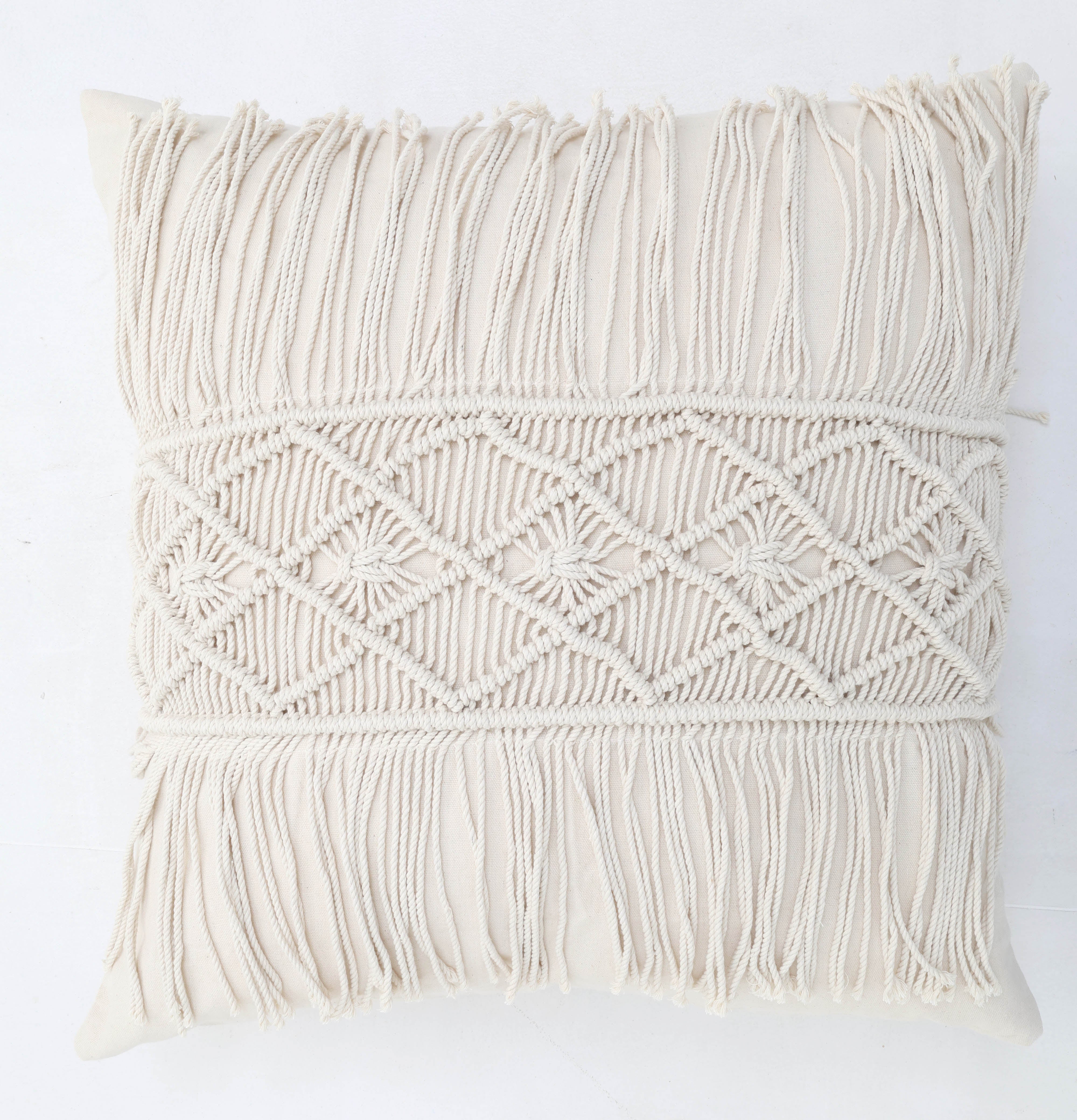 The Ramsha Home Natural Color Jute Cushion with Filler (45x45cm, CS 307) adds style to event spaces and bedrooms. This luxury decorative pillow features macramé patterns and fringe details on the front, shown against a white background.