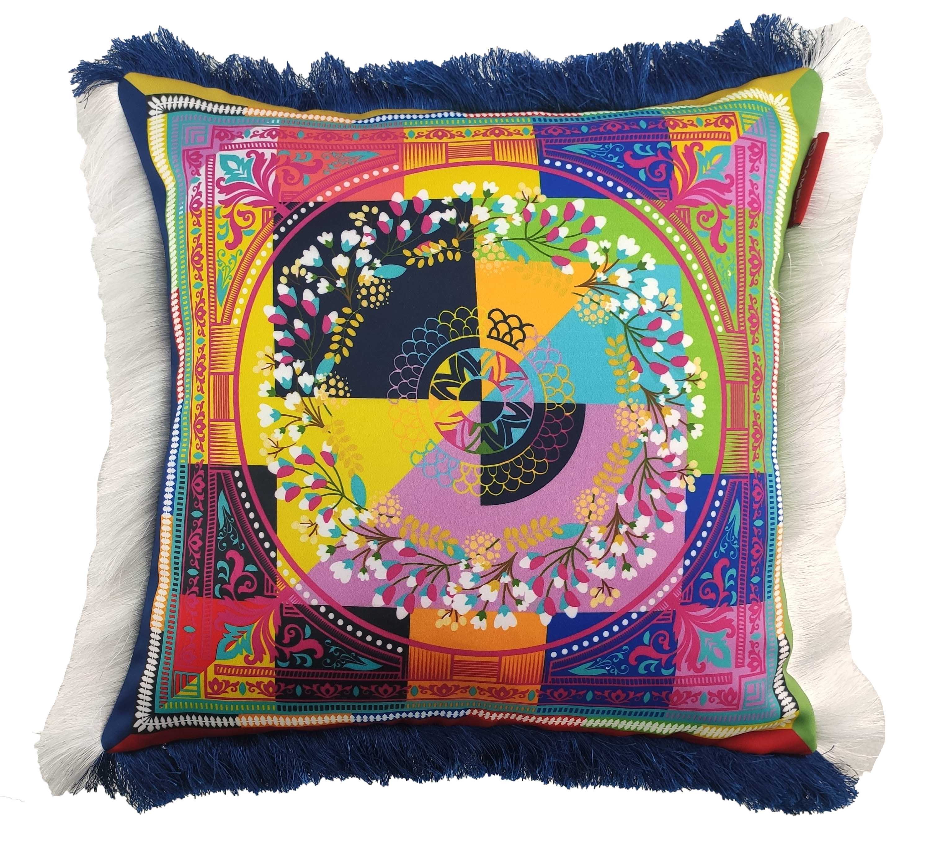 The RAMSHA HOME Modern Printed Cushion With Filler CS-057 features a colorful geometric and floral mandala design, blue fringe on top/bottom, and white fringe on the sides for a cozy decorative touch.