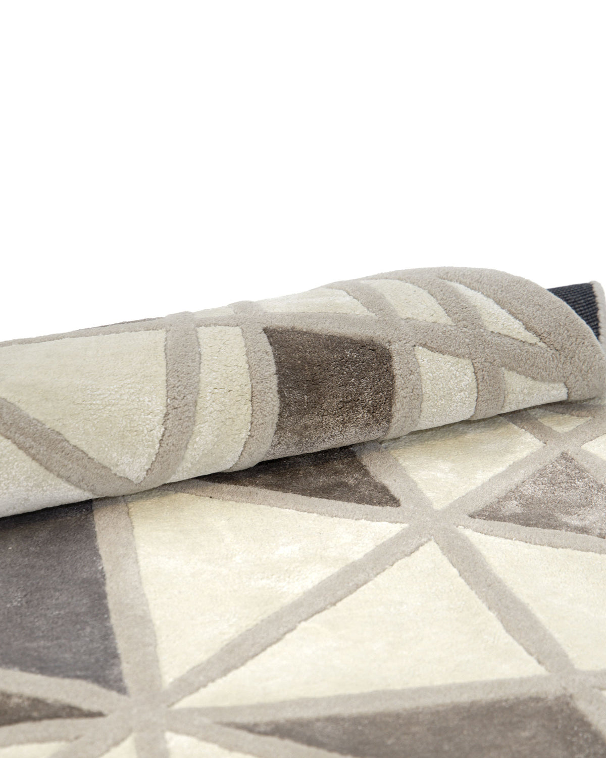 A close-up of the RAMSHA HOME Geometric Round Handmade Rug 200 cm – HTWV 206 showcases its rolled-up neutral design, featuring intersecting lines that form angular geometric shapes in beige, brown, and cream tones.