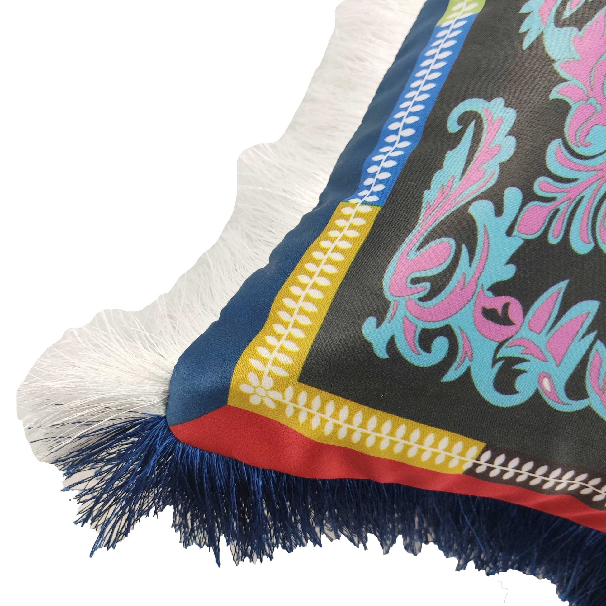 The RAMSHA HOME Polyester Cushion Multi Color CS-058 features an ornate floral pattern with a blue, yellow, and red border plus white and dark blue fringe along the edge for added style.