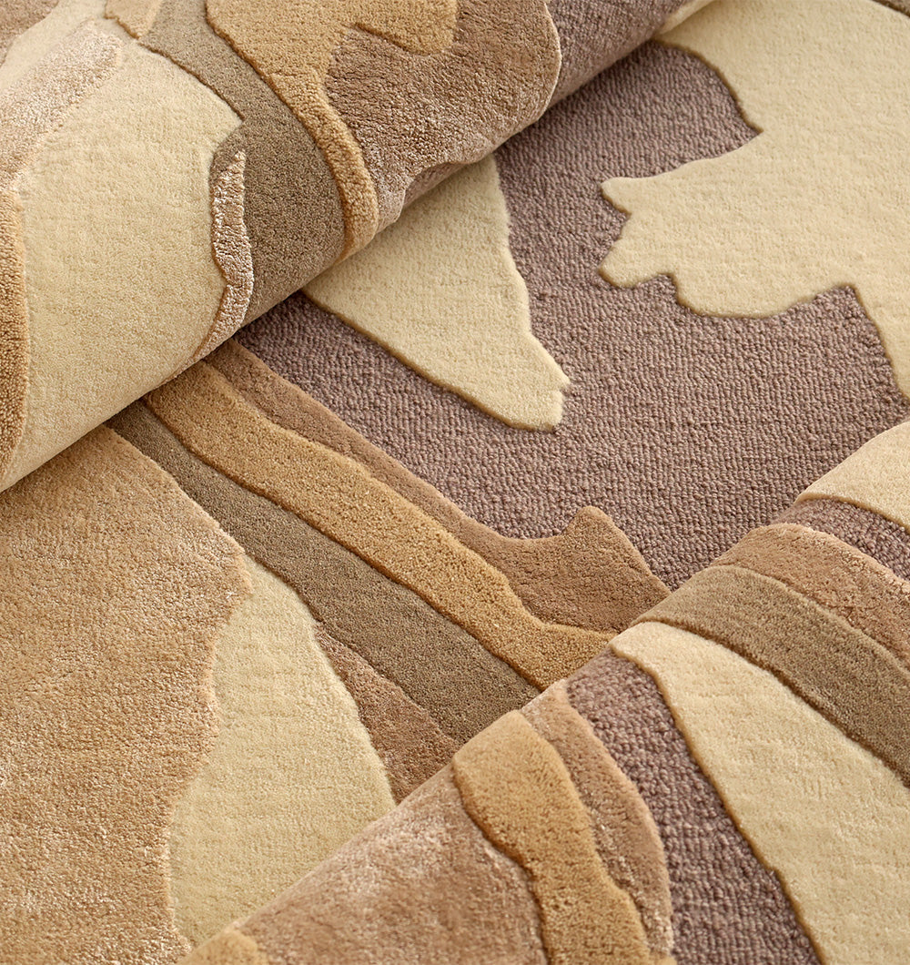 Close-up of the RAMSHA HOME Abstract Wool & Viscose Handmade Carpet 200x300 – HTWV-179, featuring a soft, plush texture and layered beige, tan, taupe, and brown pattern inspired by natural rock formations.