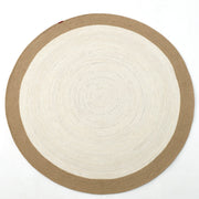 The Home Decor Round Jute Rug - BR 089 features a woven two-tone design with a light cream center, wide tan border, and is shown on a white background.