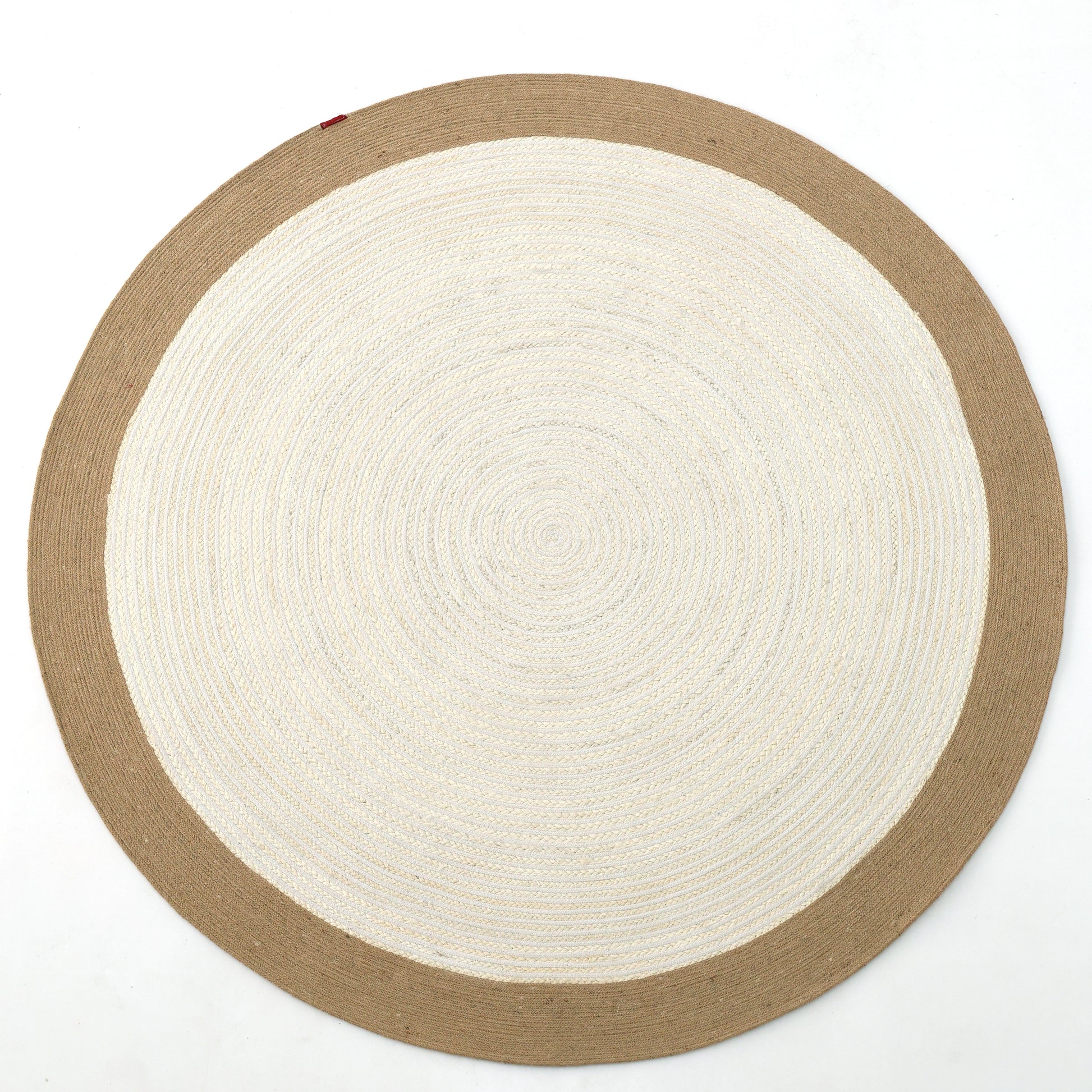 The Home Decor Round Jute Rug - BR 089 features a woven two-tone design with a light cream center, wide tan border, and is shown on a white background.