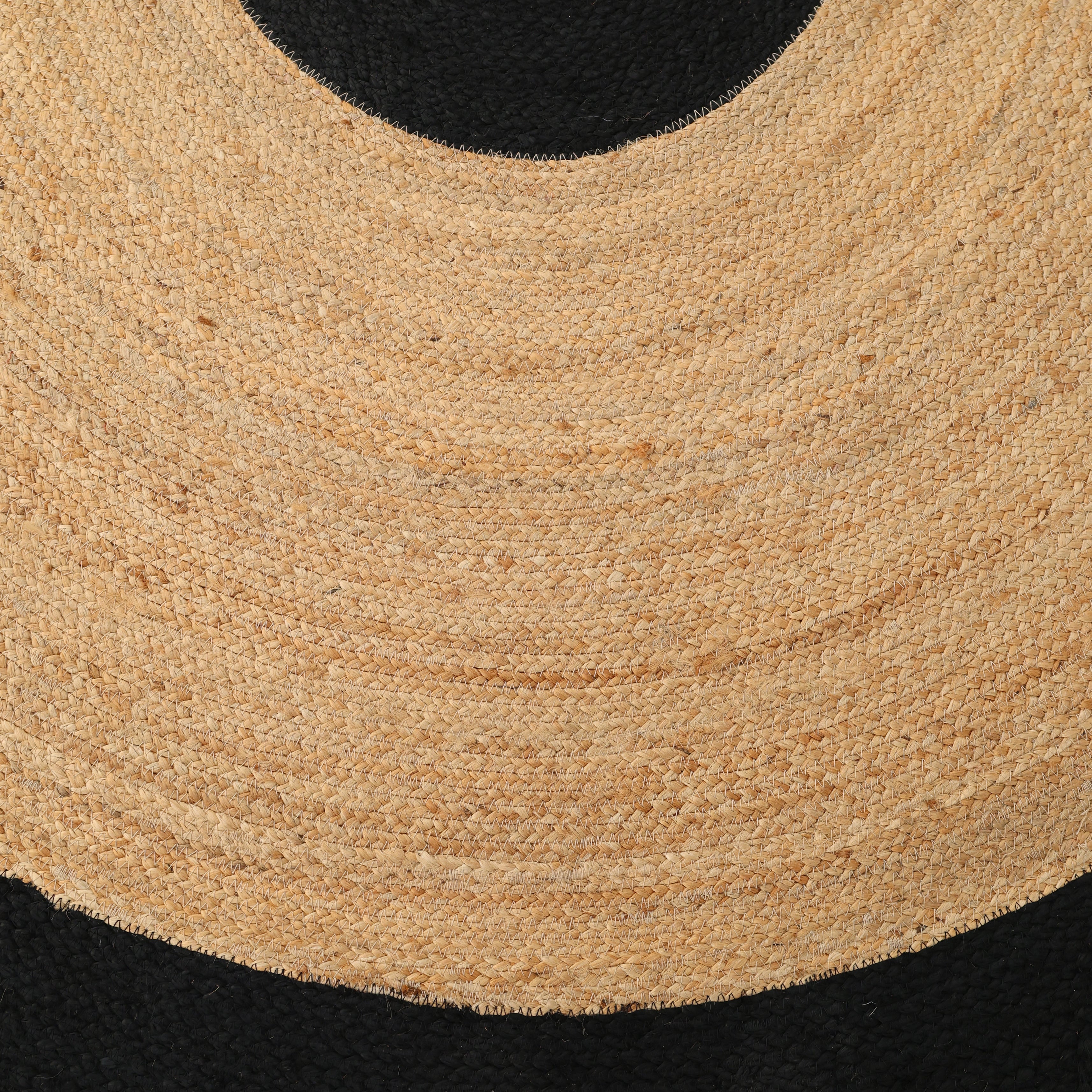 Close-up of the RAMSHA HOME Braided Rug Jute carpet BR-003, showcasing its textured circular pattern reminiscent of woven straw, set against a black background—ideal for bedroom or living room decor.