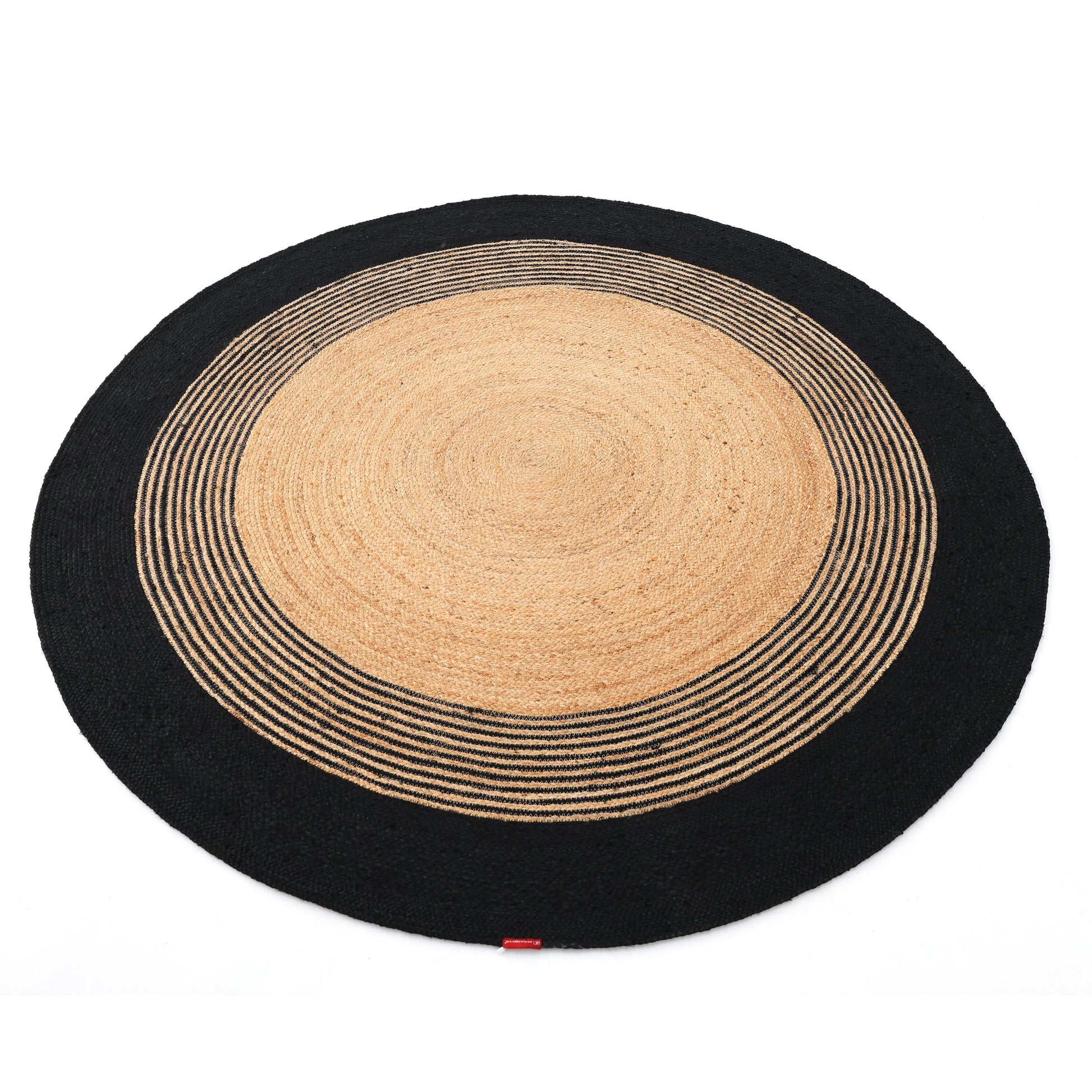 The RAMSHA HOME Luxurious Handmade Braided Jute Round Rug - BR 028 features a natural tan center with concentric tan and black stripes, finished with a bold black border for a striking accent.