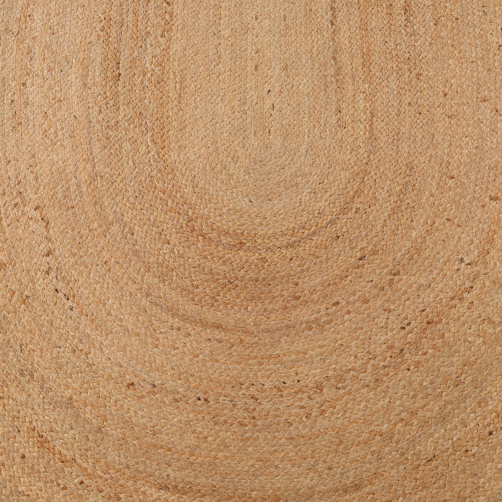 A close-up view of the RAMSHA HOME Handmade Natural Color Oval Shape Braided Rug (BR 036) highlights its textured, interlaced jute fibers in light brown tones—showcasing the beauty of this natural fiber oval rug.
