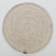 The RAMSHA HOME Natural Color Home Decor Round Jute Rug - BR 095 is a beige, textured rug with a small red tag on its edge, shown on a white background.