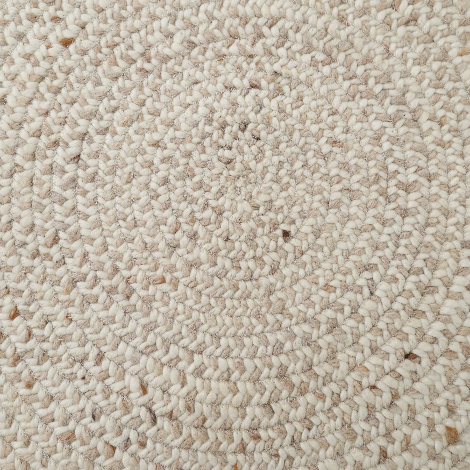 Close-up of the RAMSHA HOME Natural Color Home Decor Round Jute Rug - BR 095, featuring a circular, braided design in beige and off-white tones with a textured pattern.
