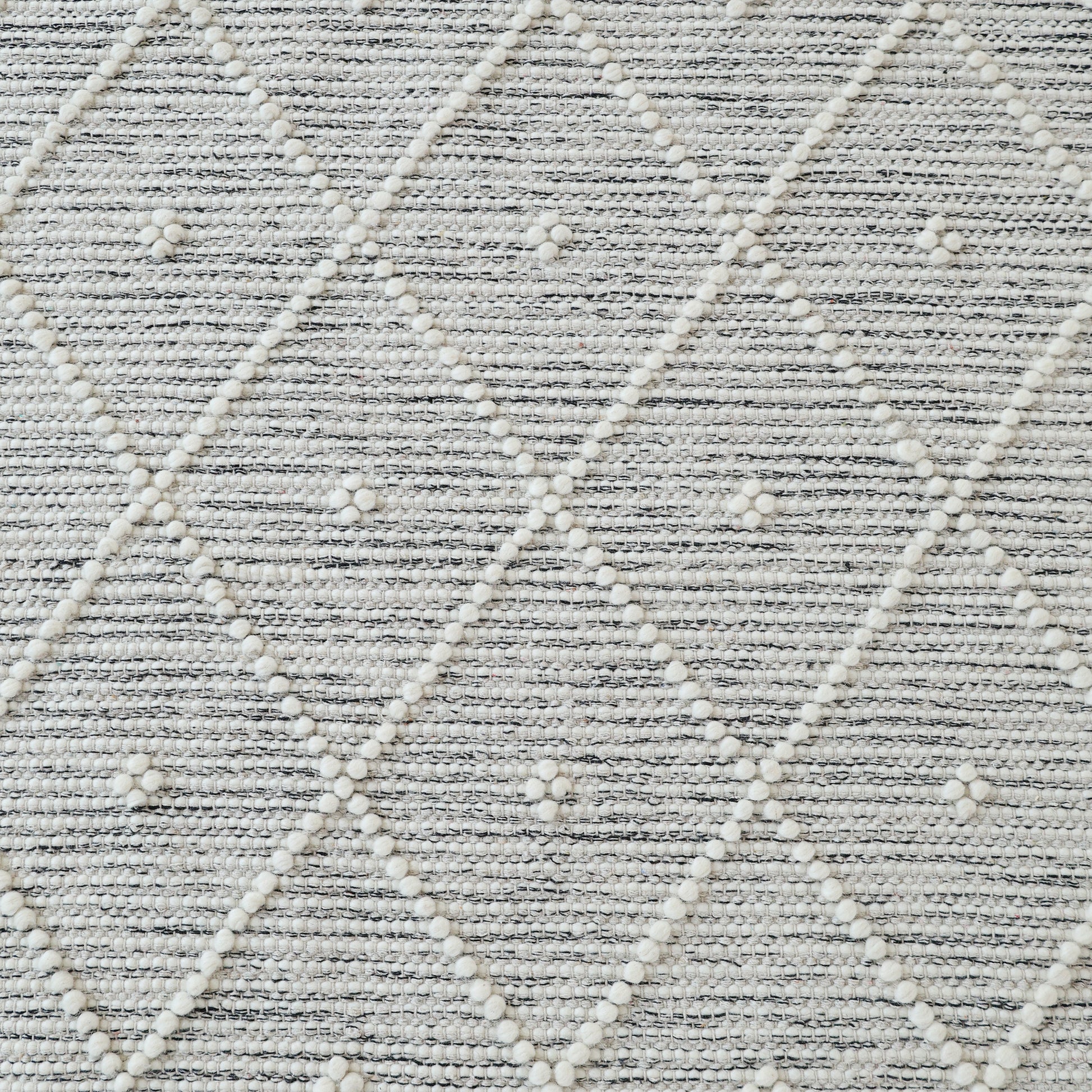 The RAMSHA HOME Natural & White Color Woven Rug SRN-012 features a textured diamond pattern with raised white dots, hand tufted from NZ wool for a soft, modern look in light and white grey tones.