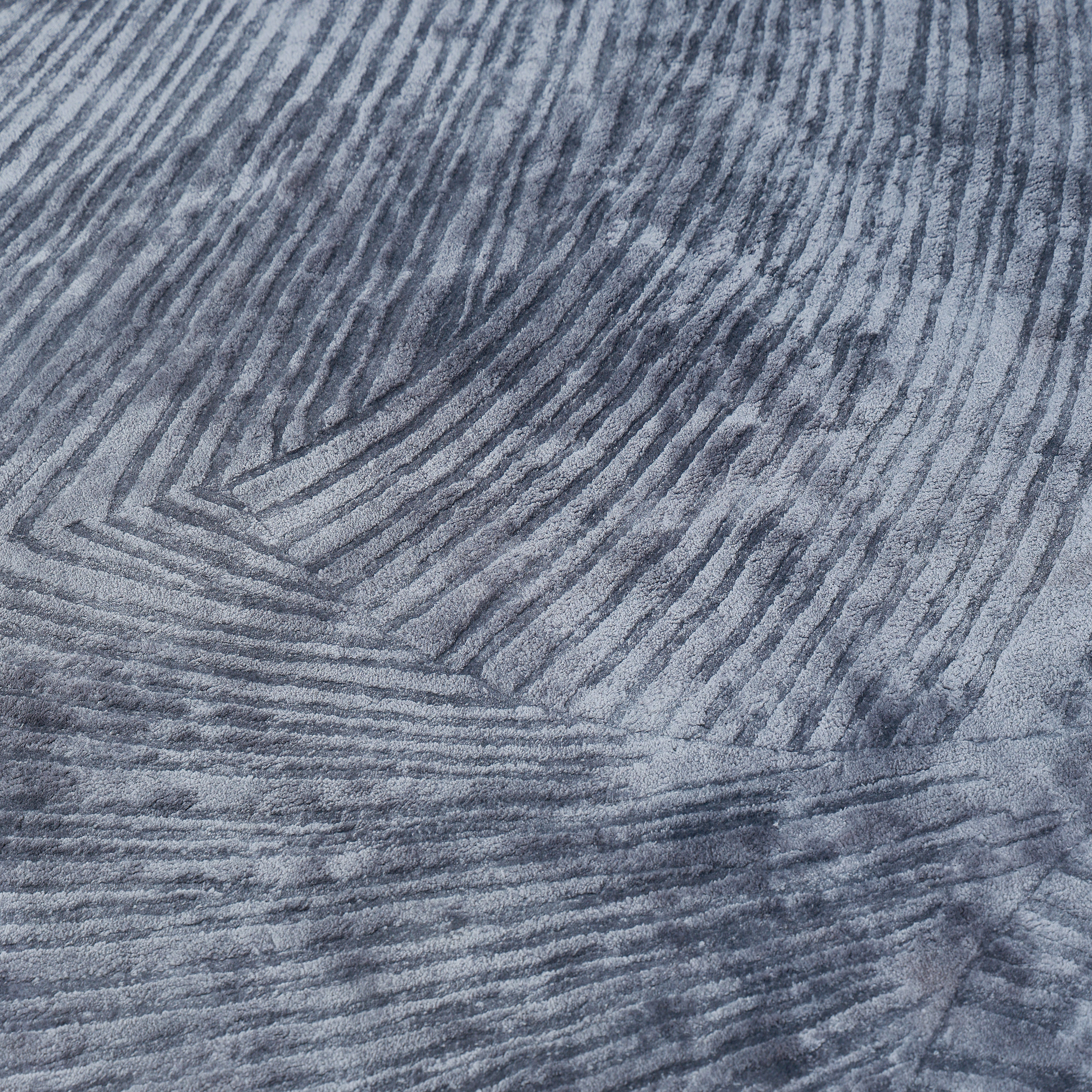 Close-up of the RAMSHA HOME Blue Ginkgo Fan Handmade Rug HTV 29 (300x400 cm), featuring textured gray Tencel cotton with curving parallel lines that evoke abstract wave or fingerprint patterns for added movement and depth.