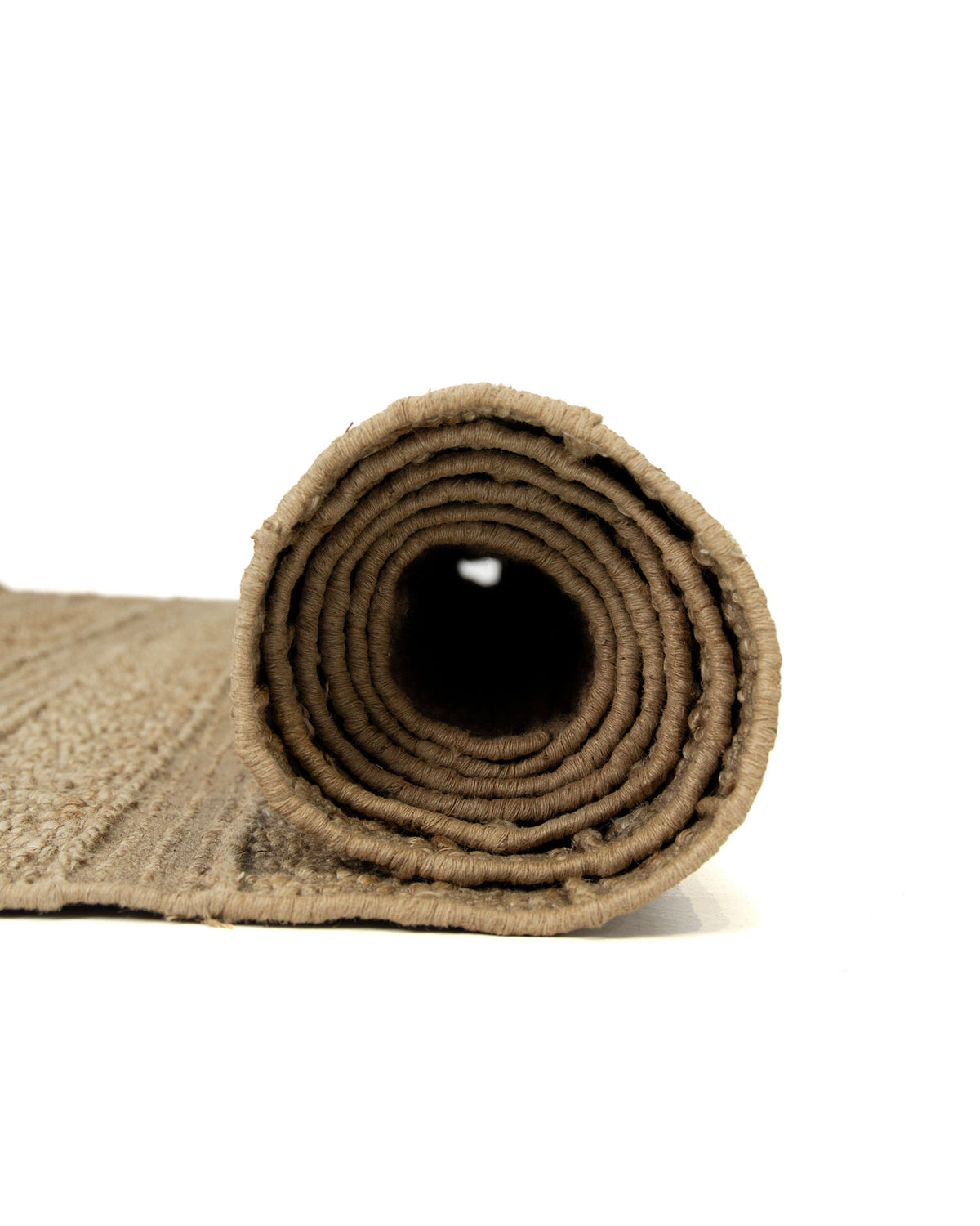 The RAMSHA HOME Natural Color Hand Woven Area Rug WR-033 is displayed partially rolled up on a white background, showcasing its natural jute texture with the roll facing forward.
