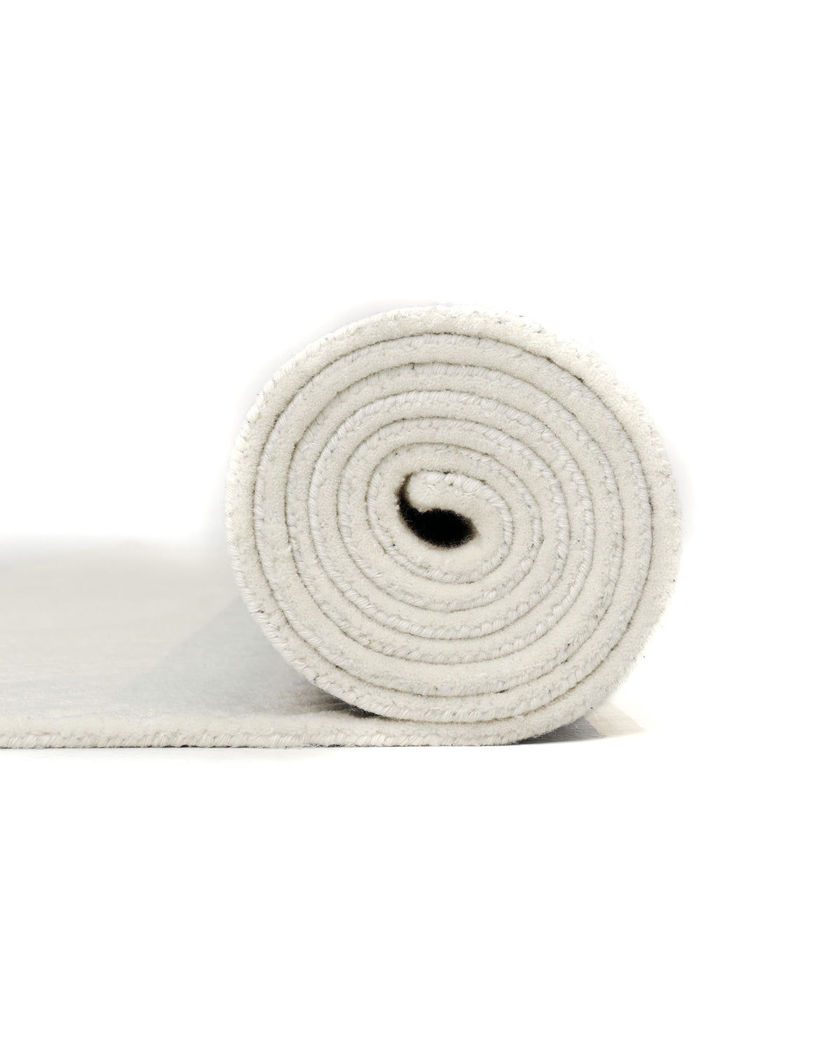A close-up of the RAMSHA HOME Natural White Color Handmade Area Rug - HTW-89 (300X400 CM), artfully rolled to showcase its elegant spiral form against a plain white background, highlights the rug’s soft texture and understated sophistication—an ideal piece for minimalist, neutral interiors.
