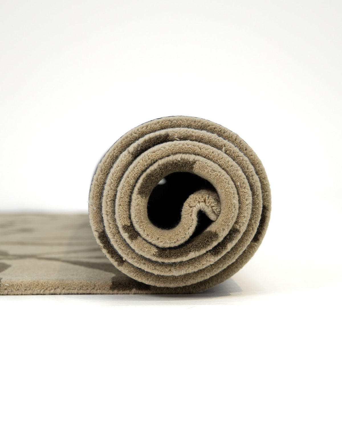 Here’s the rewritten sentence using the product data: A close-up side view of the RAMSHA HOME Stunning Multi Color Fluffy Wool Handmade Rug - HTW 21 (202x292cm), rolled up to showcase its soft, textured wool surface in vibrant hues, placed on a white surface against a plain white background.
