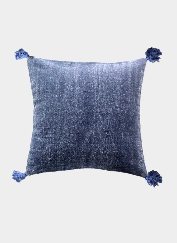 The RAMSHA HOME Polyester Geometry Cushion With Tassel cs-238 is a square blue velvet cushion with soft texture and matching blue tassels on each corner, adding comfort and elegance to any space. Displayed against a white background.