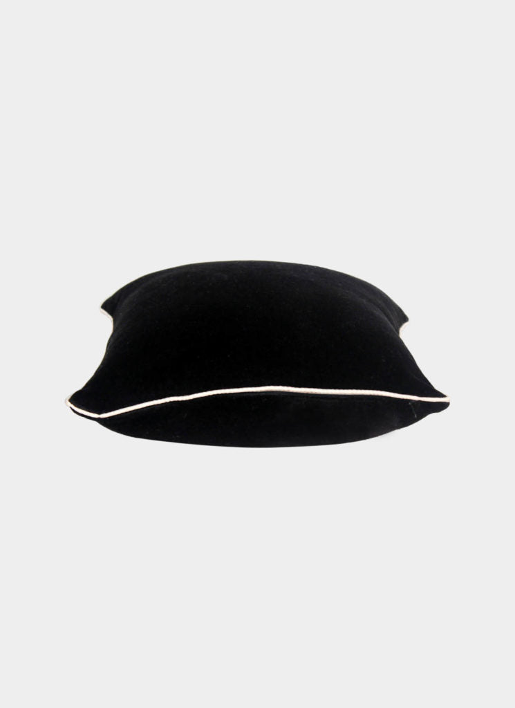 The RAMSHA HOME Polyester Cushion Plain With Filler cs-233 features black velvet fabric, plush filling, and white edge piping, displayed on a light gray background for an elegant look.
