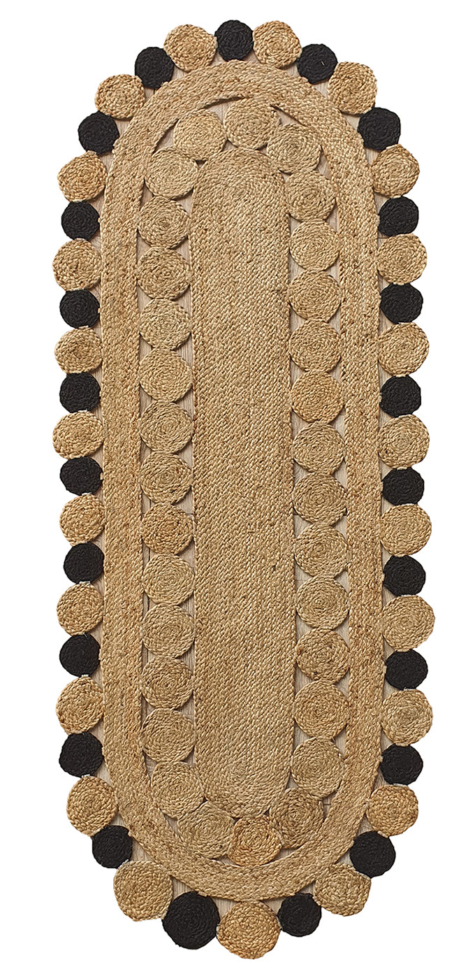 The RAMSHA HOME Oval Shaped Jute Braided Rug Black & Natural BR-033 features a natural tan hue, braided texture, and two rows of alternating tan and black pom-pom-like accents for stylish appeal.