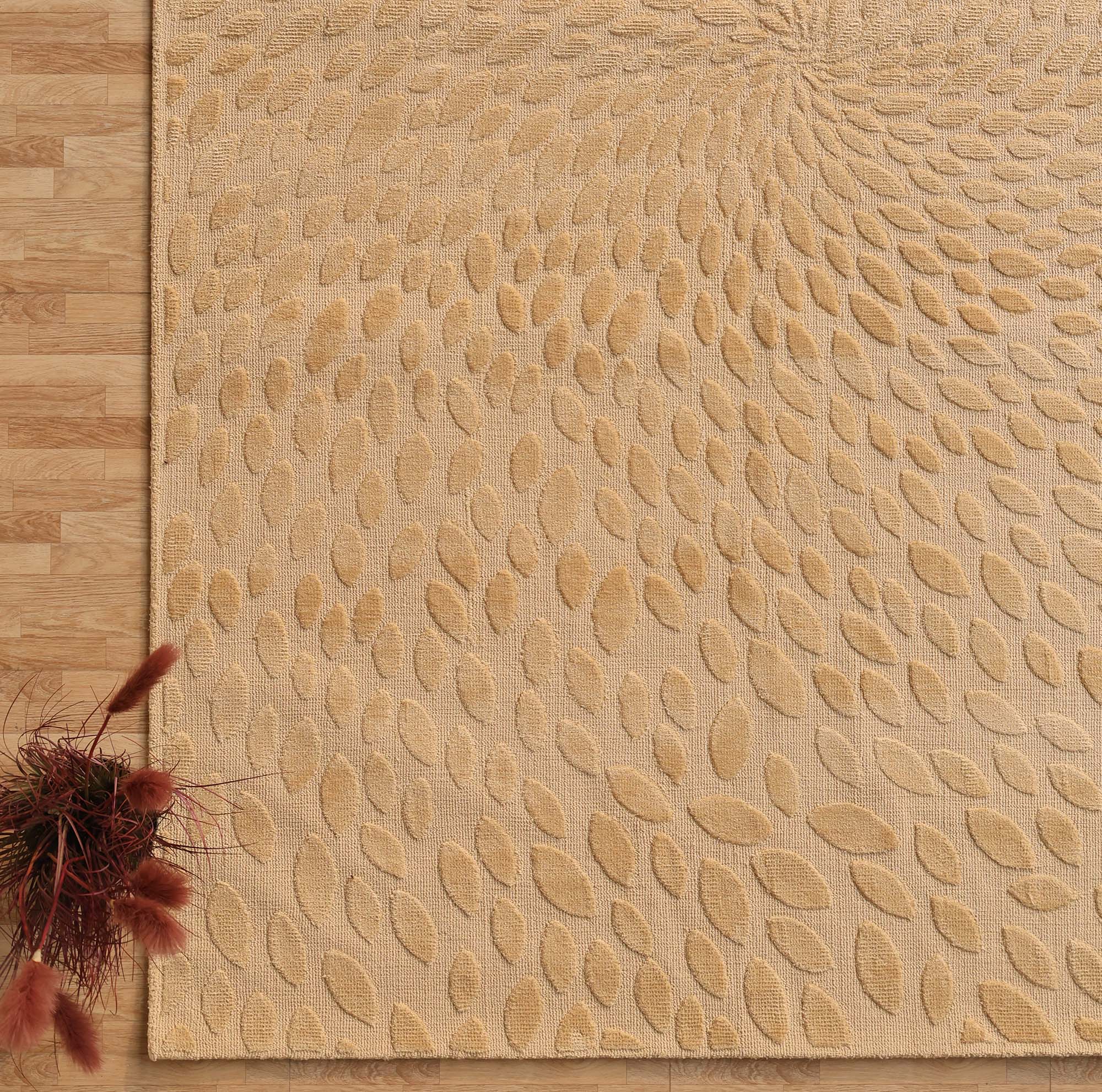 The RAMSHA HOME Modern Abstract 200x300 CM Rectangle Shaped Rug CMN 107, featuring a beige hue and raised swirling leaf pattern, is styled on a light wood floor with brown dried flowers in the lower left corner for added charm.