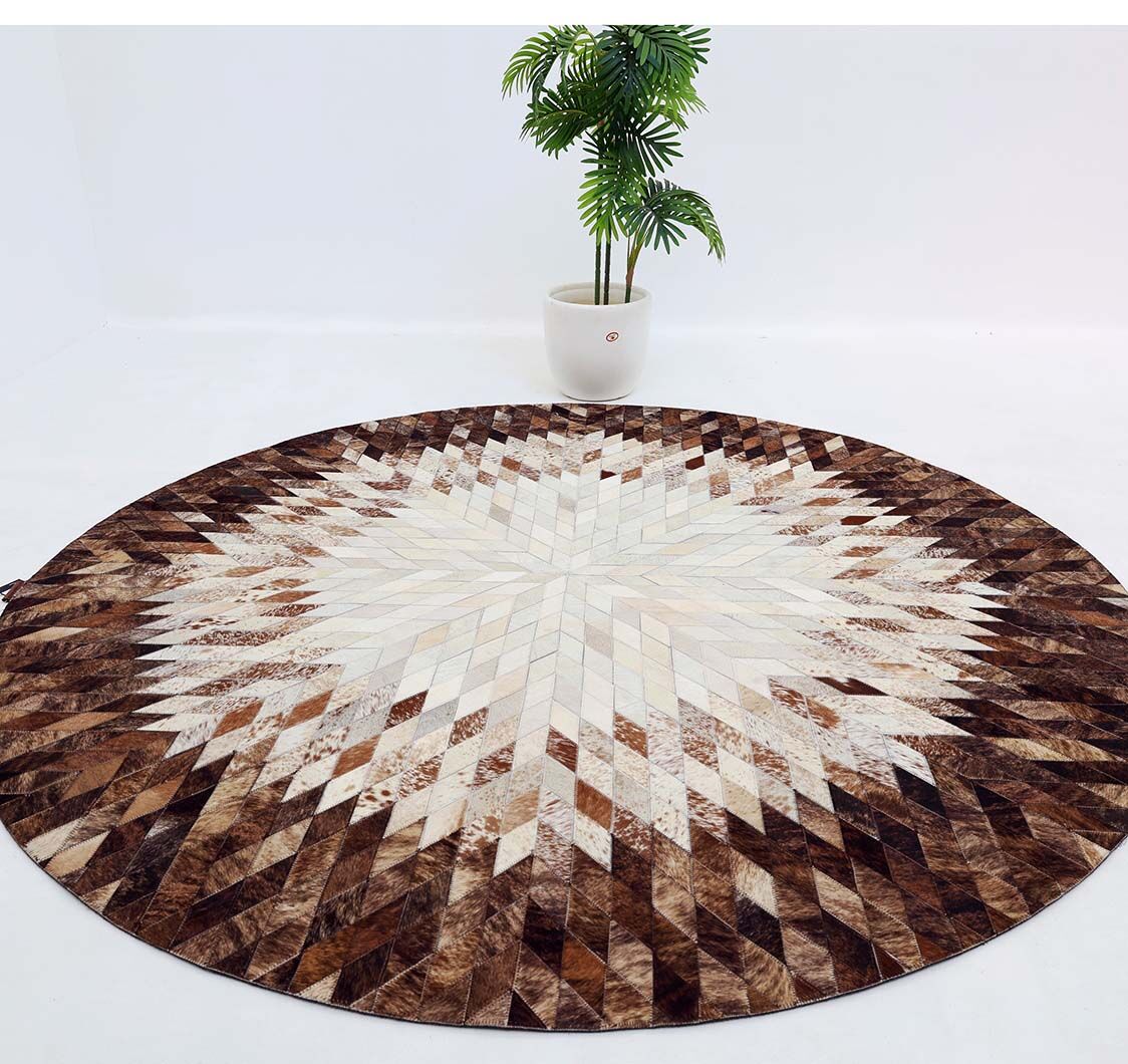 The RAMSHA HOME Multi Color Guest Room Round Decor Leather Rug - LR 022, featuring a starburst pattern in brown, beige, and cream, is displayed on a white floor with a green potted plant behind it against a plain white background.