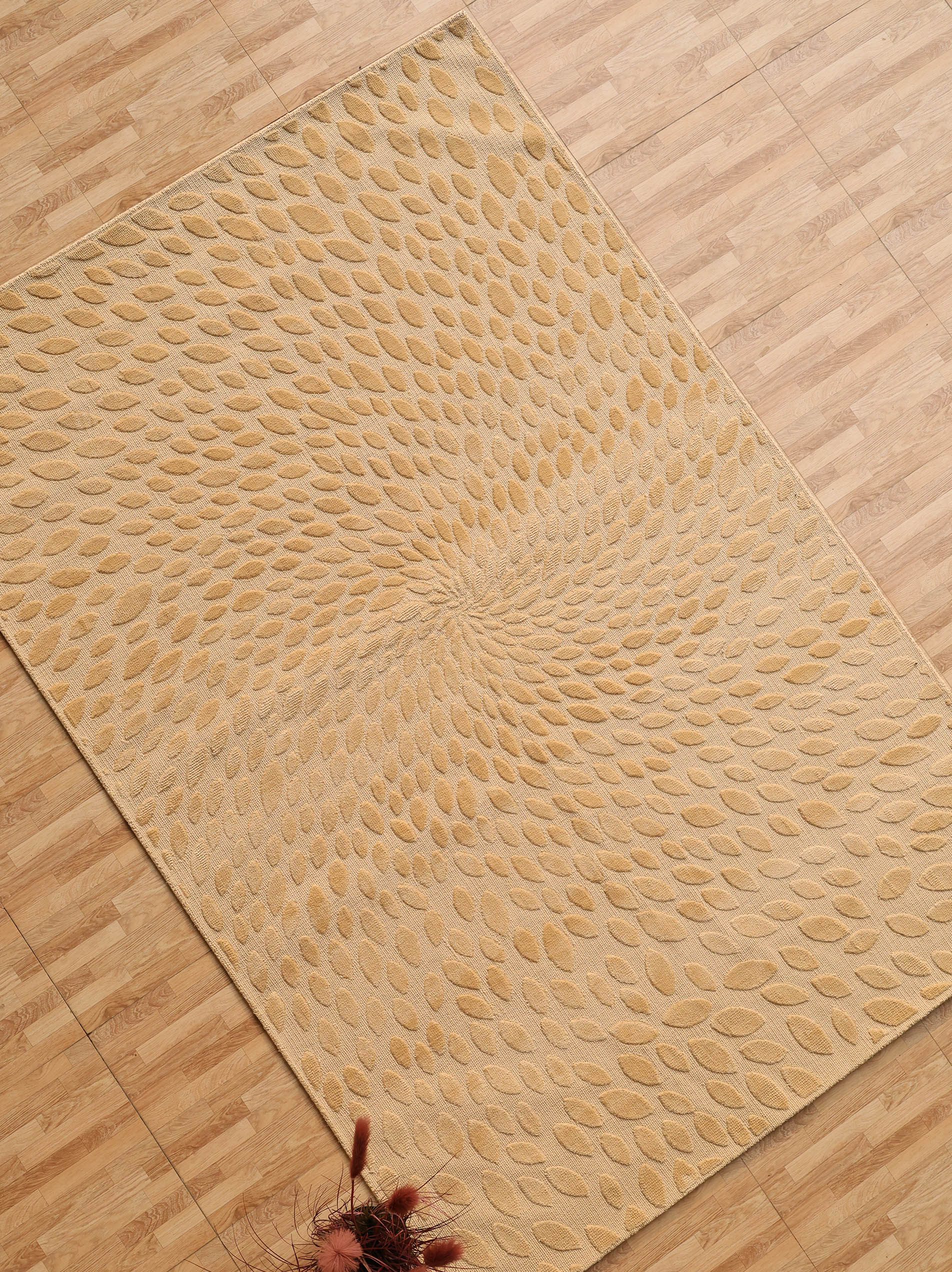 The RAMSHA HOME Modern Abstract 200x300 CM Rectangle Shaped Rug (CMN 107), featuring a beige raised leaf pattern in a swirling design, is displayed on a light wood floor with dried flowers partially visible in the corner.