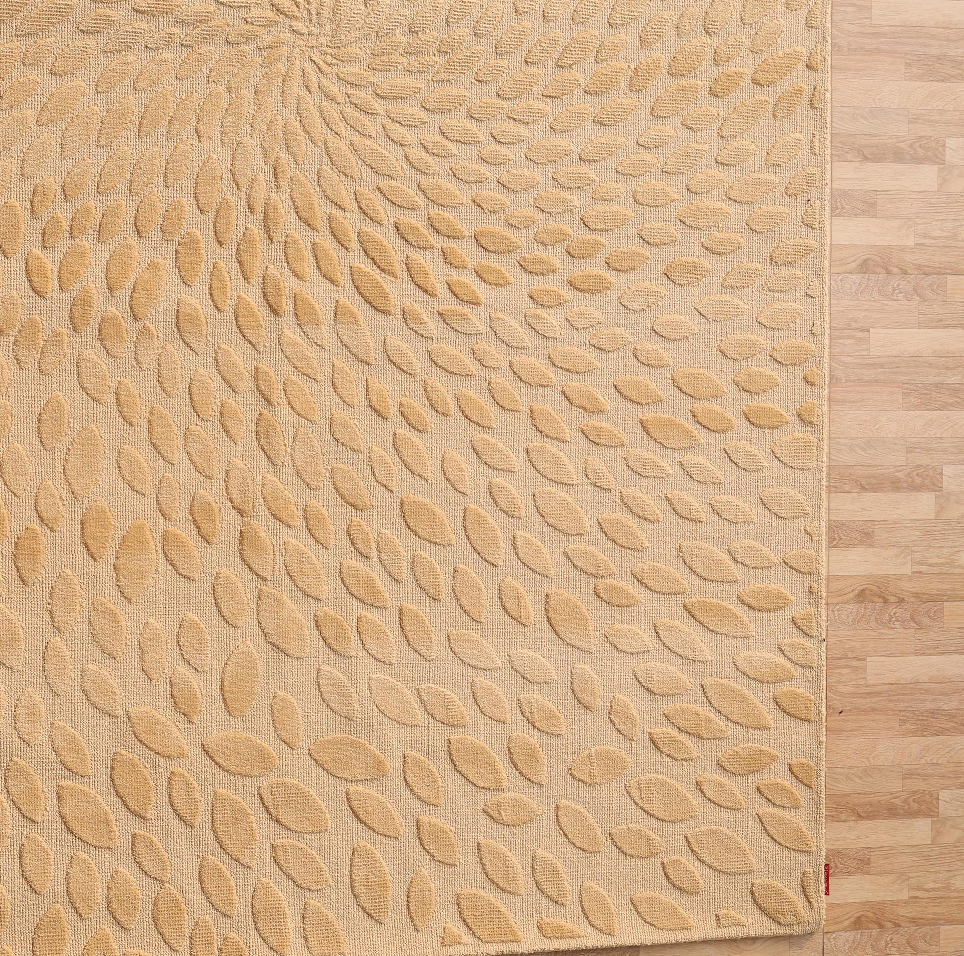 The RAMSHA HOME Modern Abstract 200x300 CM Rectangle Rug (CMN 107) in beige, with a raised leaf spiral pattern, brings subtle elegance to light wood floors.