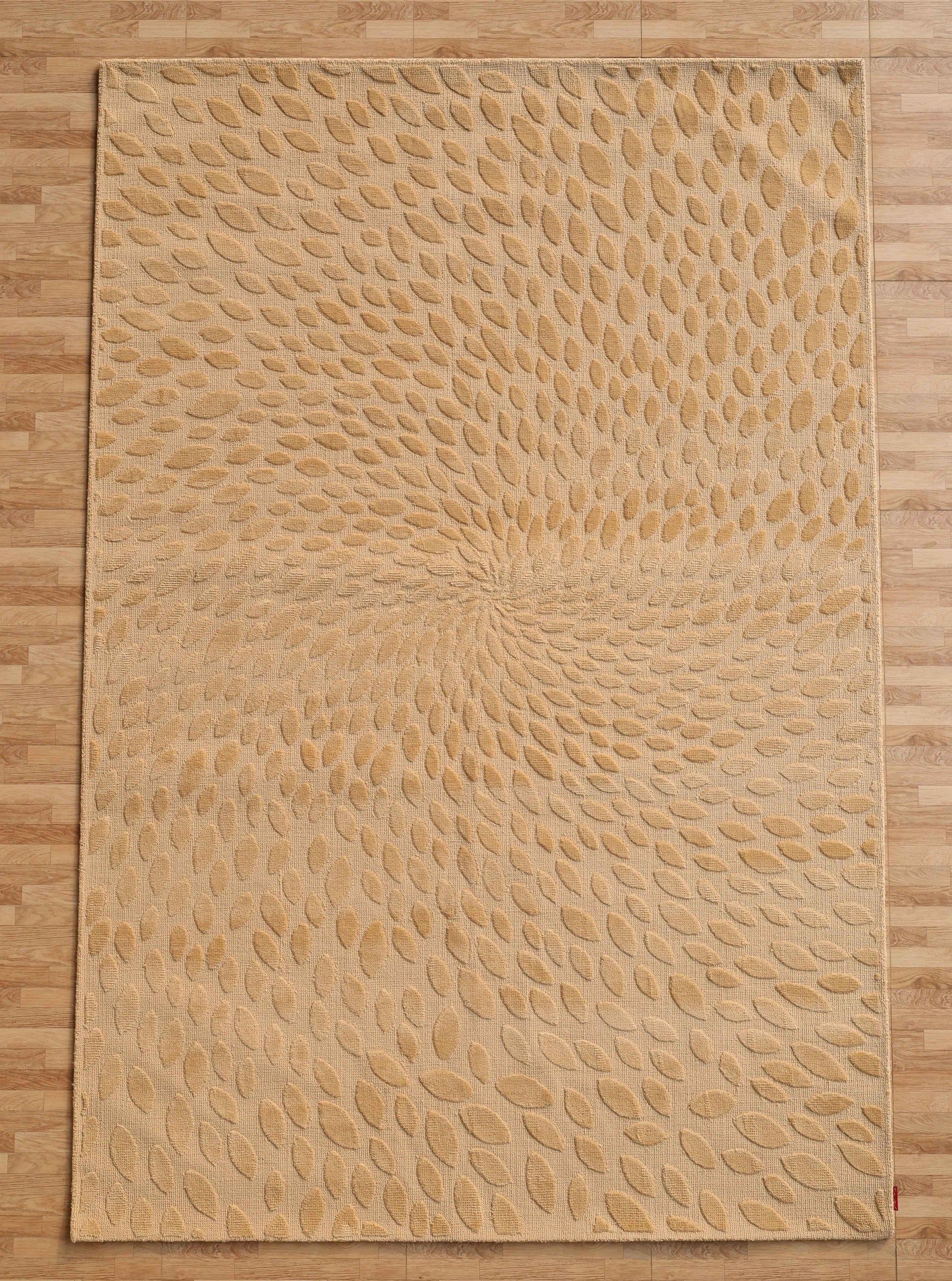 The RAMSHA HOME Modern Abstract 200x300 CM Rectangle Shaped Rug CMN 107, in beige with a swirling raised leaf pattern, adds textured movement to a light wood floor through its striking abstract design.