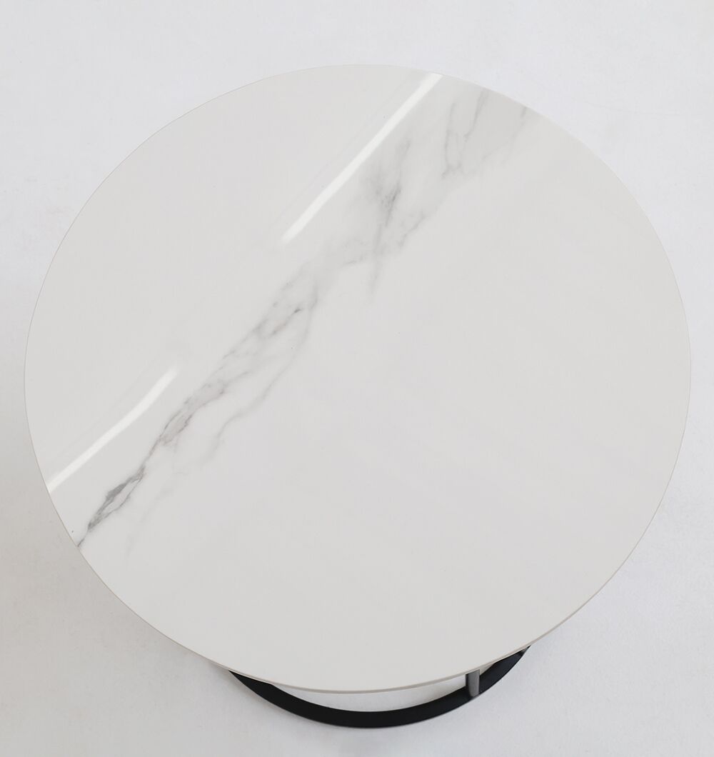 The RAMSHA HOME Linea Round Marble Accent Table features a round white marble tabletop with subtle gray veining and a glossy finish, viewed from above, showcasing its modern design and partially visible black circular base.