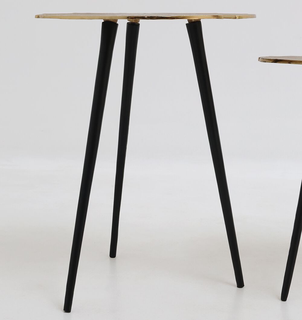The Lily Luxe Aluminum Accent Tables by RAMSHA HOME feature two modern nesting tables with three black angled legs and sleek, round, light-colored tops—perfect for mixing and matching or as part of a round side table set. Displayed on a plain white background.