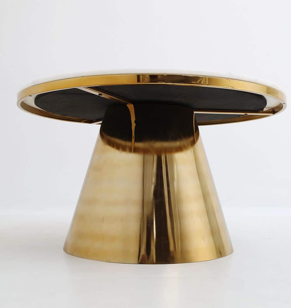 The Aurelia Luxe Marble & Iron Accent Table AD25-27 by RAMSHA HOME features a glossy gold cone-shaped base and a smooth white marble top, displayed against a plain white background.