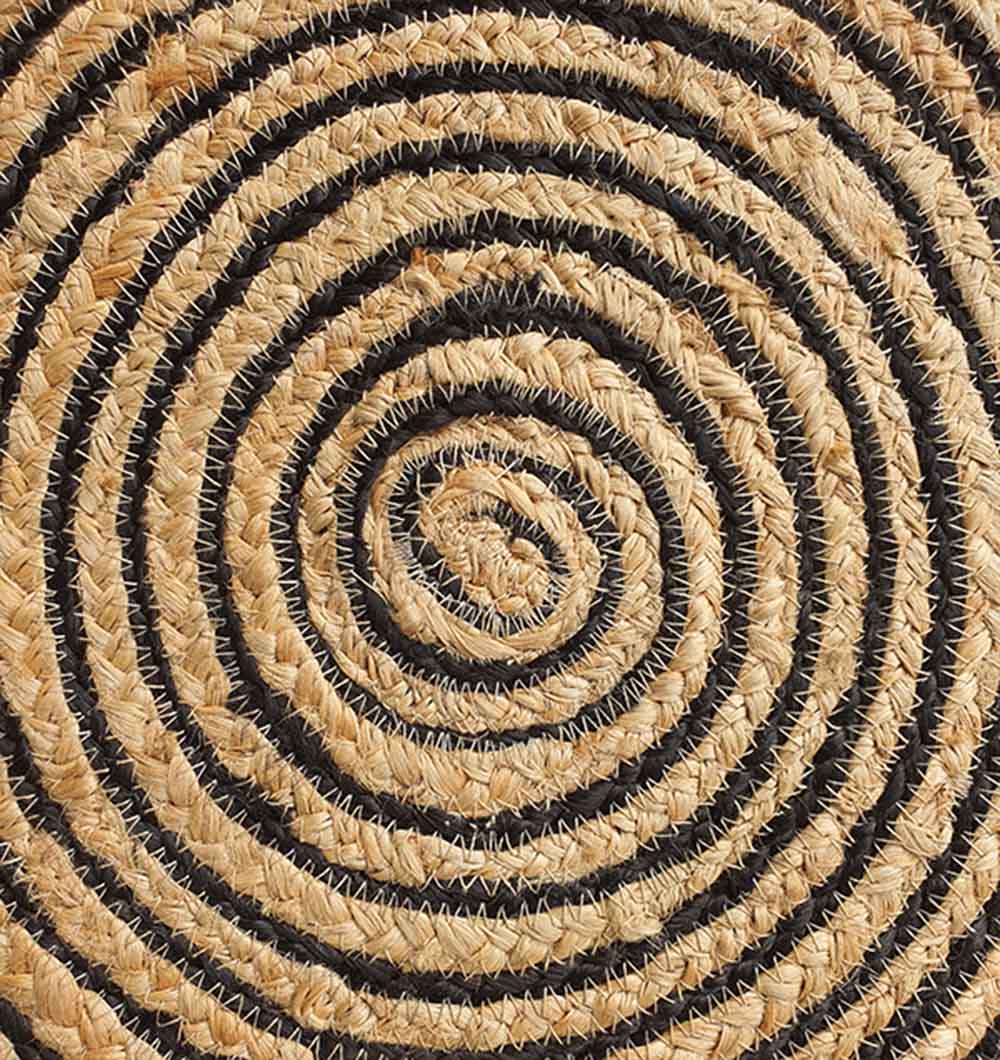 Close-up of the Natural & Black Color Braided Rug (BR-004), an eco-friendly jute carpet featuring concentric circles in tan and black for a striking spiral pattern with textured natural fibers.