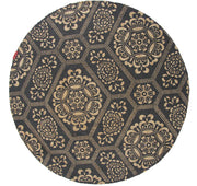 The RAMSHA HOME Jute Natural Rug Round BR-066 (90 cm) features a brown color and showcases an intricate design with floral and geometric accents, adding elegance to any room.