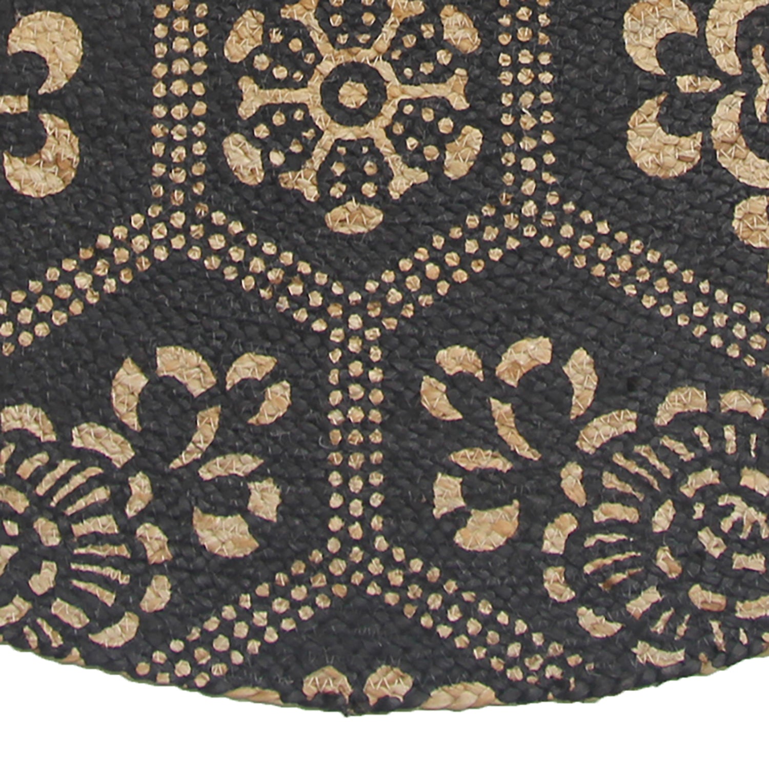 Close-up of the RAMSHA HOME Jute Natural Rug Round (BR-066, 90 cm), featuring black hexagonal floral patterns on a tan background. The brown jute material showcases textured, intricate craftsmanship.