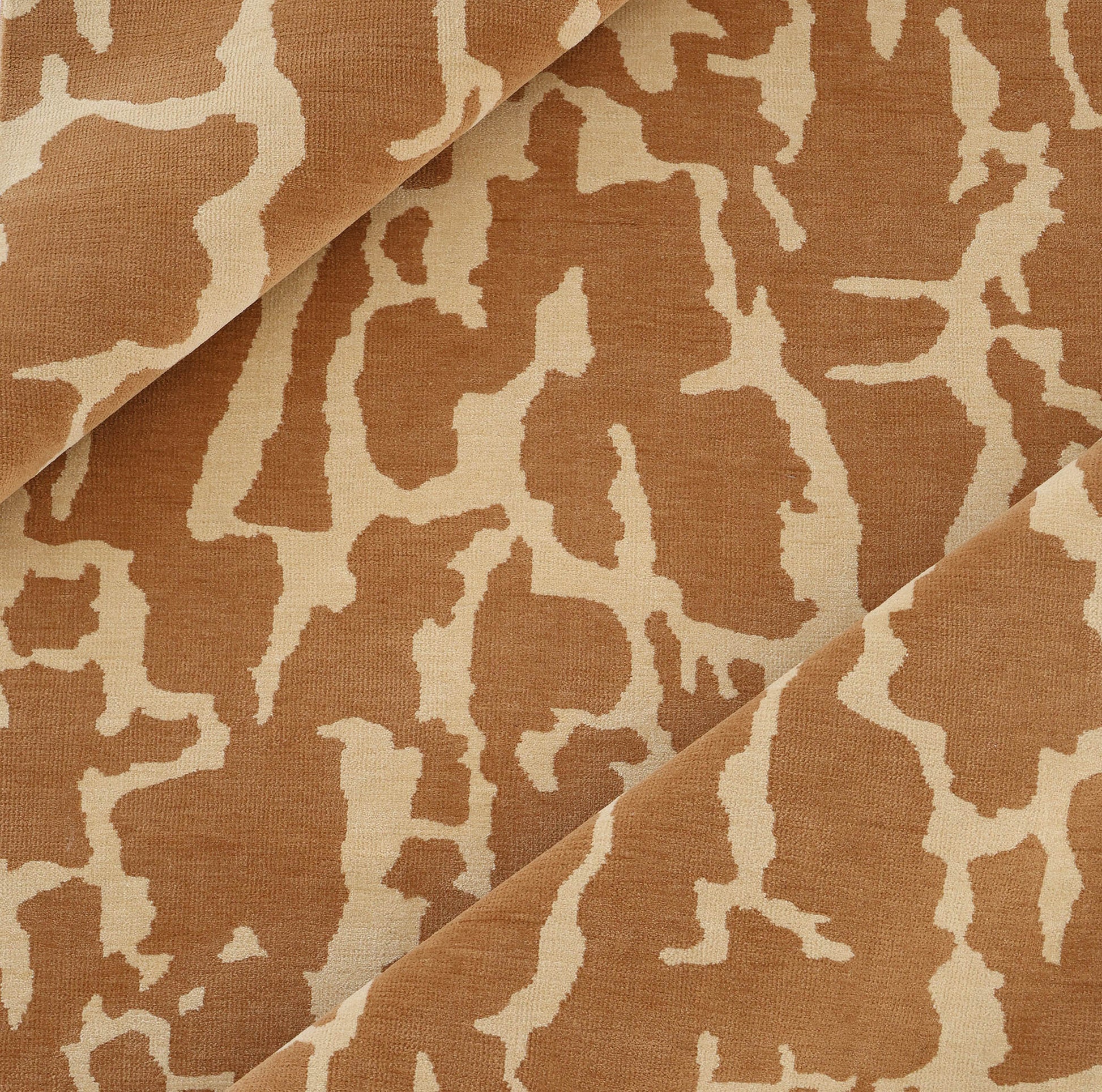 Close-up of the RAMSHA HOME Natural Drift Round Area Rug CMN 116, featuring light brown fabric with an abstract beige pattern and organic shapes in overlapping folds, evoking a handcrafted, modern look.
